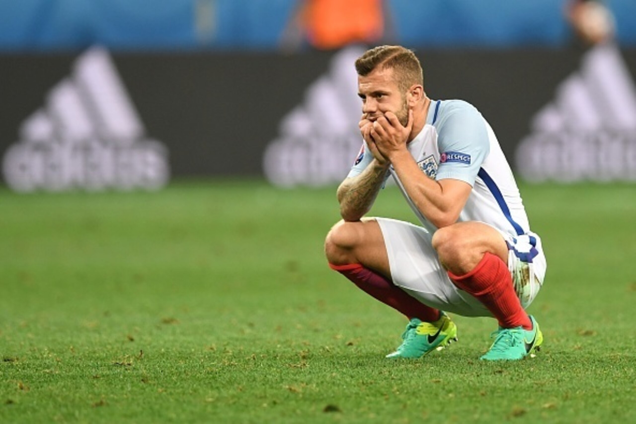 England's midfielder Jack Wilshere reacts after England lost 1-2 to Iceland in the Euro 2016 round of 16 football match between England and Iceland at the Allianz Riviera stadium in Nice on June 27, 2016.   / AFP / PAUL ELLIS        (Photo credit should r