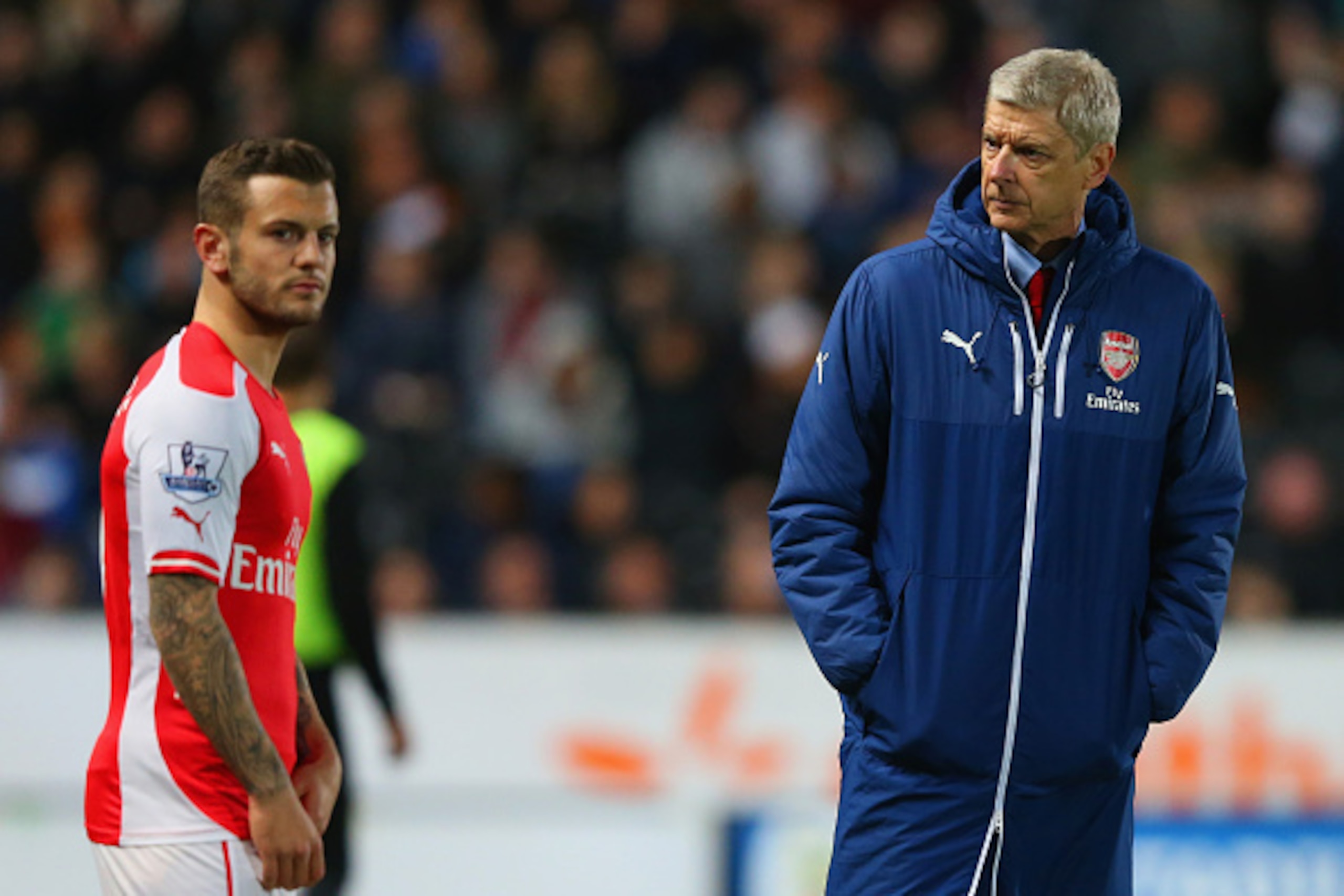 HULL, ENGLAND - MAY 04:  Arsene Wenger manager of Arsenal looks on as Jack Wilshere of Arsenal prepares to come onto the pitch during the Barclays Premier League match between Hull City and Arsenal at KC Stadium on May 4, 2015 in Hull, England.  (Photo by