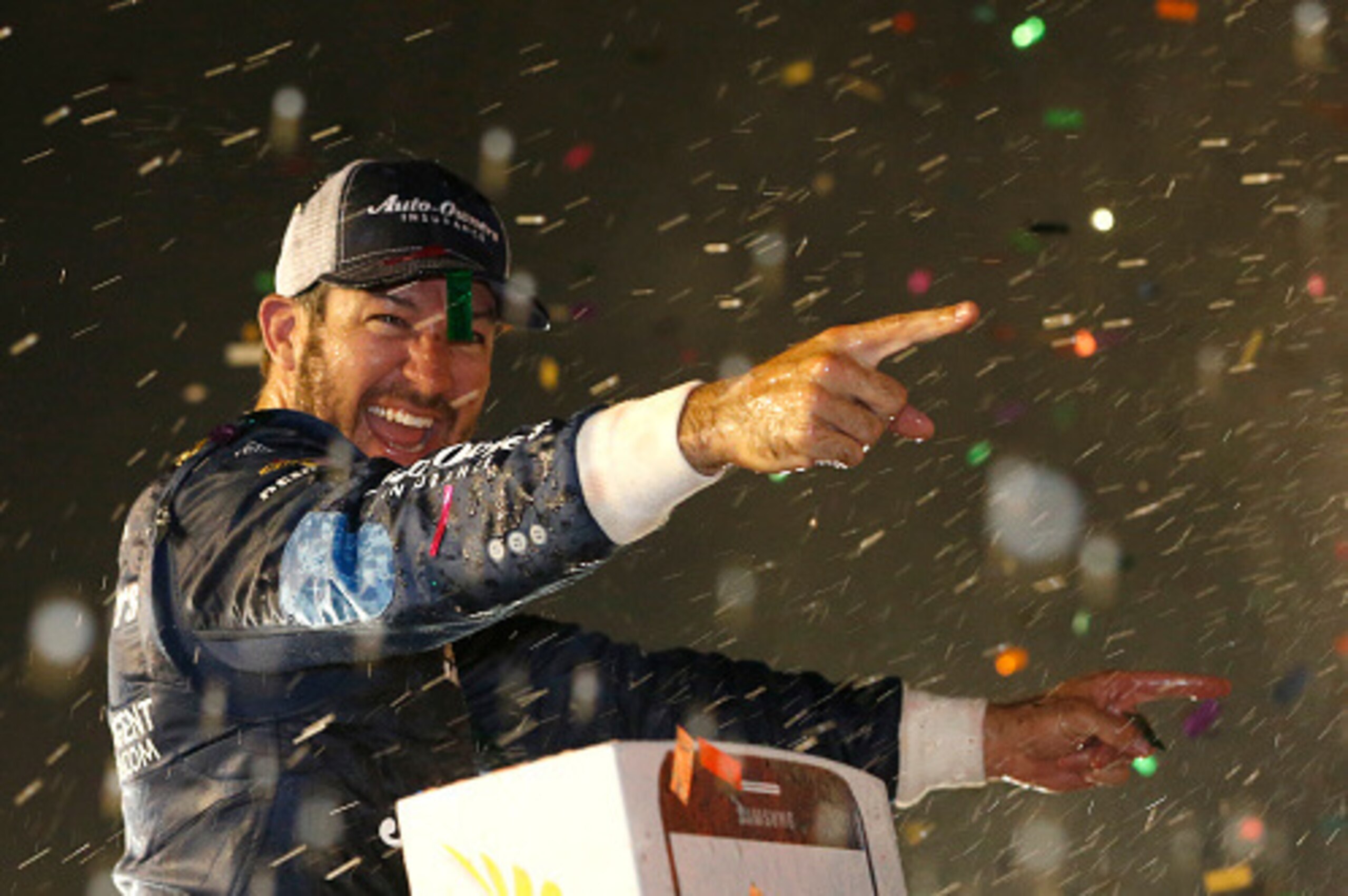 DARLINGTON, SC - SEPTEMBER 04:  Martin Truex, Jr., driver of the #78 Auto-Owners Insurance Toyota, celebrates in Victory Lane after winning the NASCAR Sprint Cup Series Bojangles' Southern 500 at Darlington Raceway on September 4, 2016 in Darlington, Sout