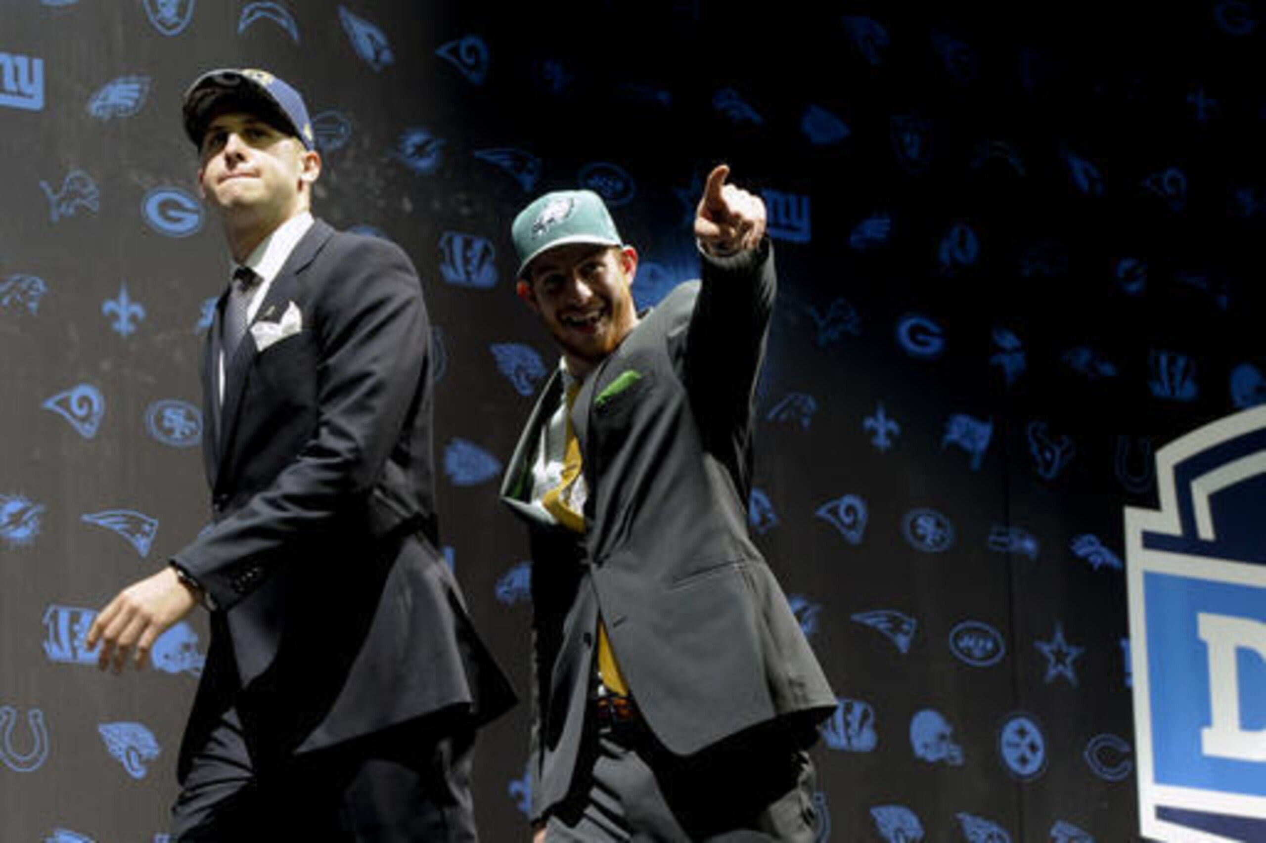 Jared Goff and Carson Wentz are the new rookie quarterbacks of Sam Bradford's former teams.