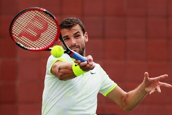 NEW YORK, NY - SEPTEMBER 03:  Grigor Dimitrov of Bulgaria returns a shot to Joao Sousa of Portugal during his third round Men's Singles match on Day Six of the 2016 US Open at the USTA Billie Jean King National Tennis Center on September 3, 2016 in the Fl