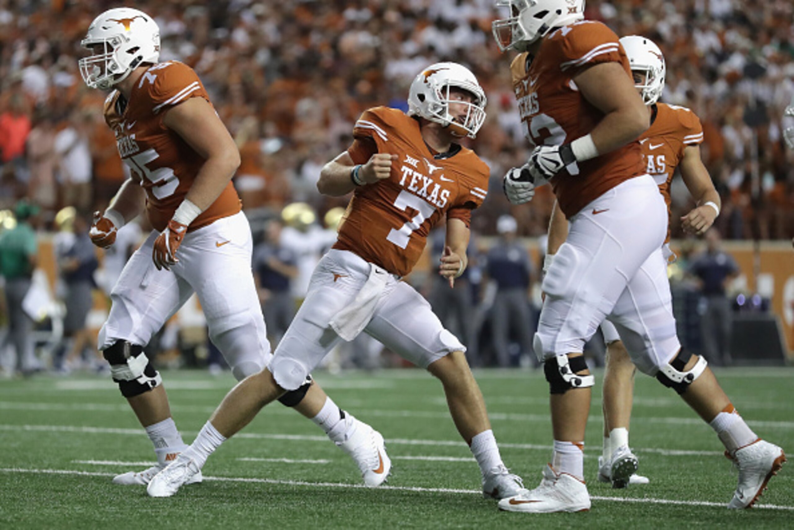 AUSTIN, TX - SEPTEMBER 04:  Shane Buechele #7 of the Texas Longhorns celebrates with teammates after a second quarter touchdown against the Notre Dame Fighting Irish at Darrell K. Royal-Texas Memorial Stadium on September 4, 2016 in Austin, Texas.  (Photo