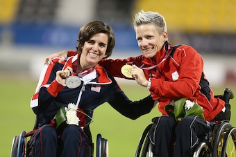 DOHA, QATAR - OCTOBER 31:  Marieke Vervoort of Belgium celebrates her gold with Kerry Morgan of USA and her silver in the women's 400m T52 final during the Evening Session on Day Ten of the IPC Athletics World Championships at Suhaim Bin Hamad Stadium on 