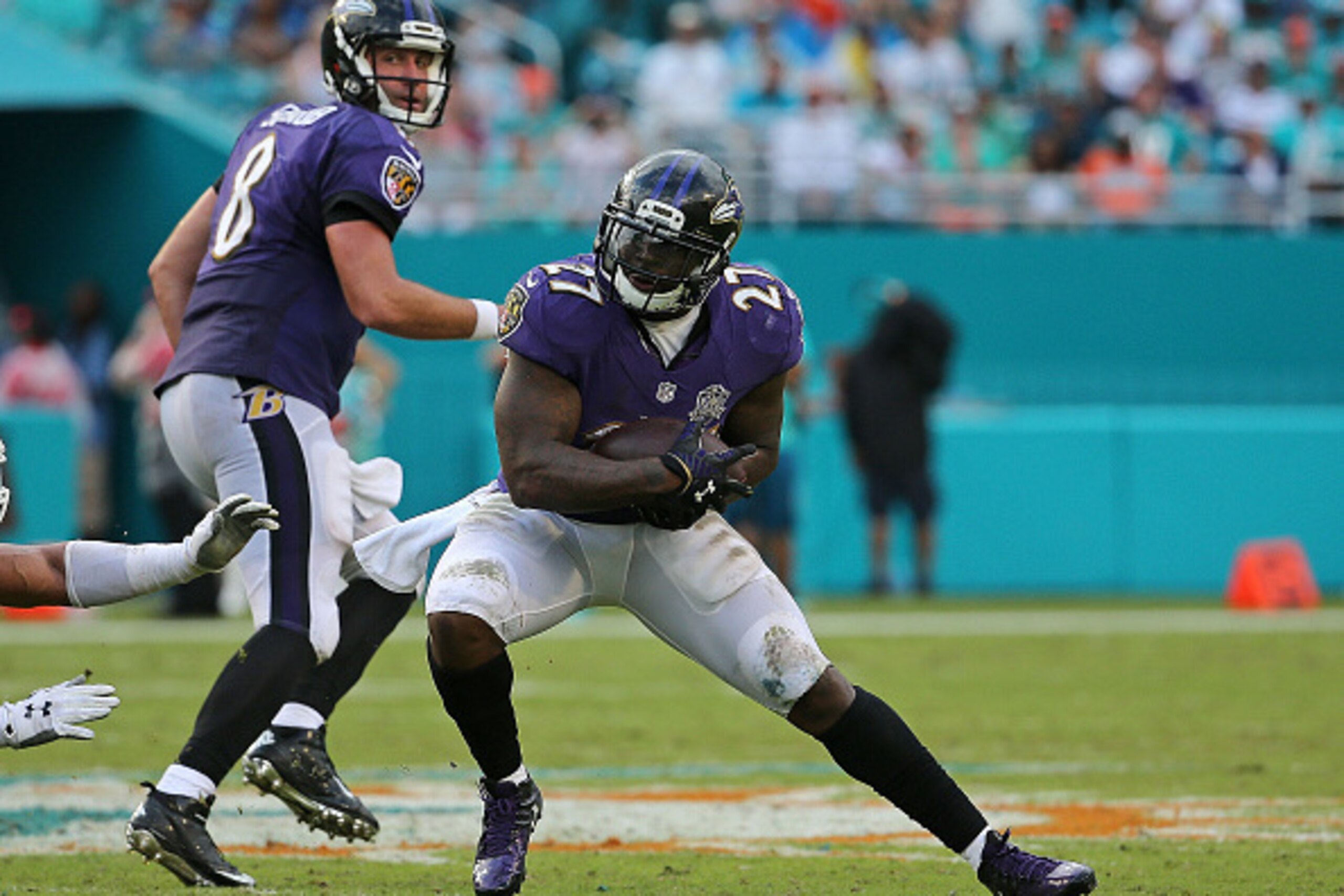 MIAMI GARDENS, FL - DECEMBER 06: Terrance West #27 of the Baltimore Ravens rushes during a game against the Miami Dolphins at Sun Life Stadium on December 6, 2015 in Miami Gardens, Florida.  (Photo by Mike Ehrmann/Getty Images)