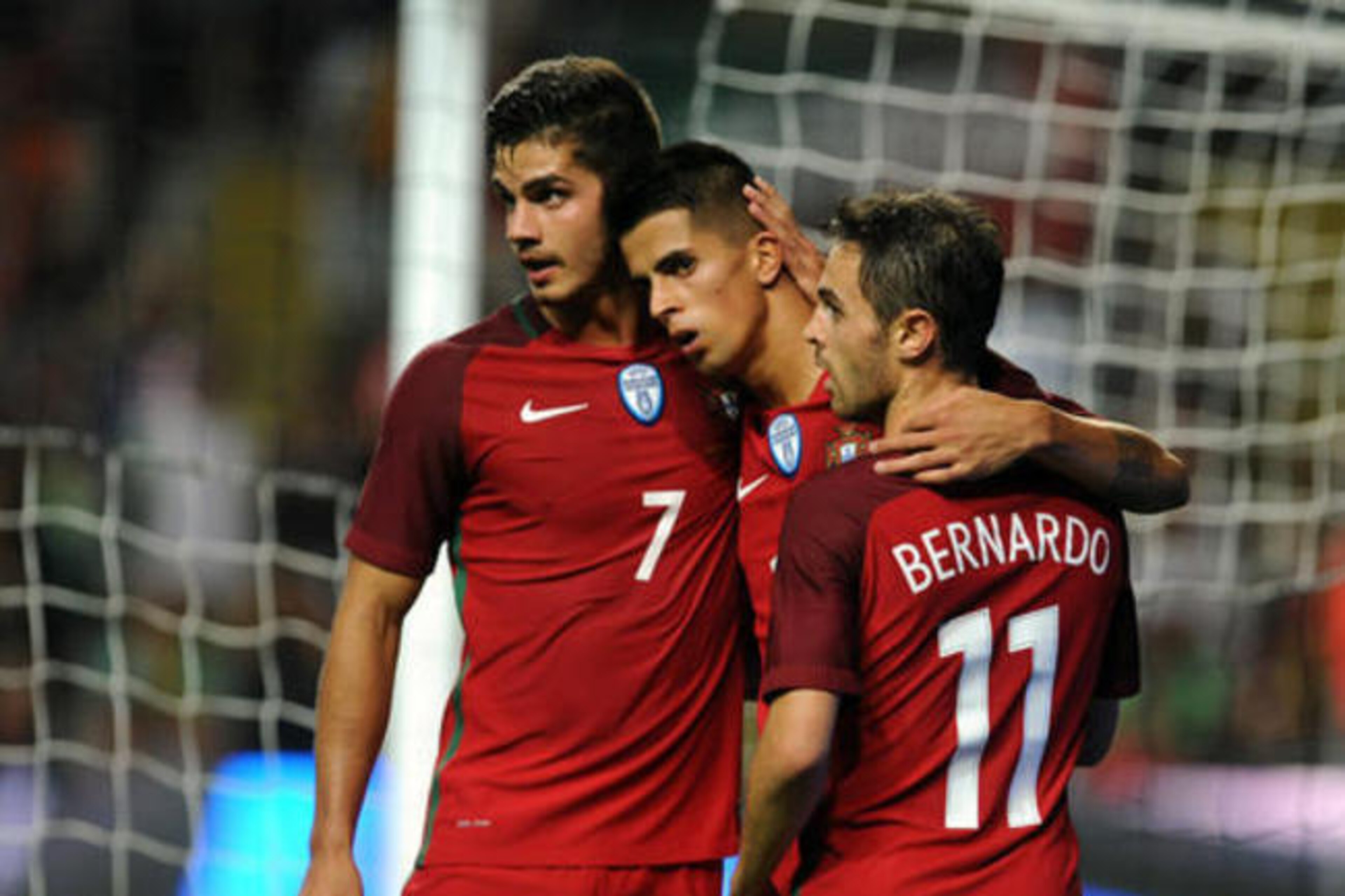 Andre Silva, left, celebrates with Joao Cancelo and Bernardo Silva in the Gibraltar match.