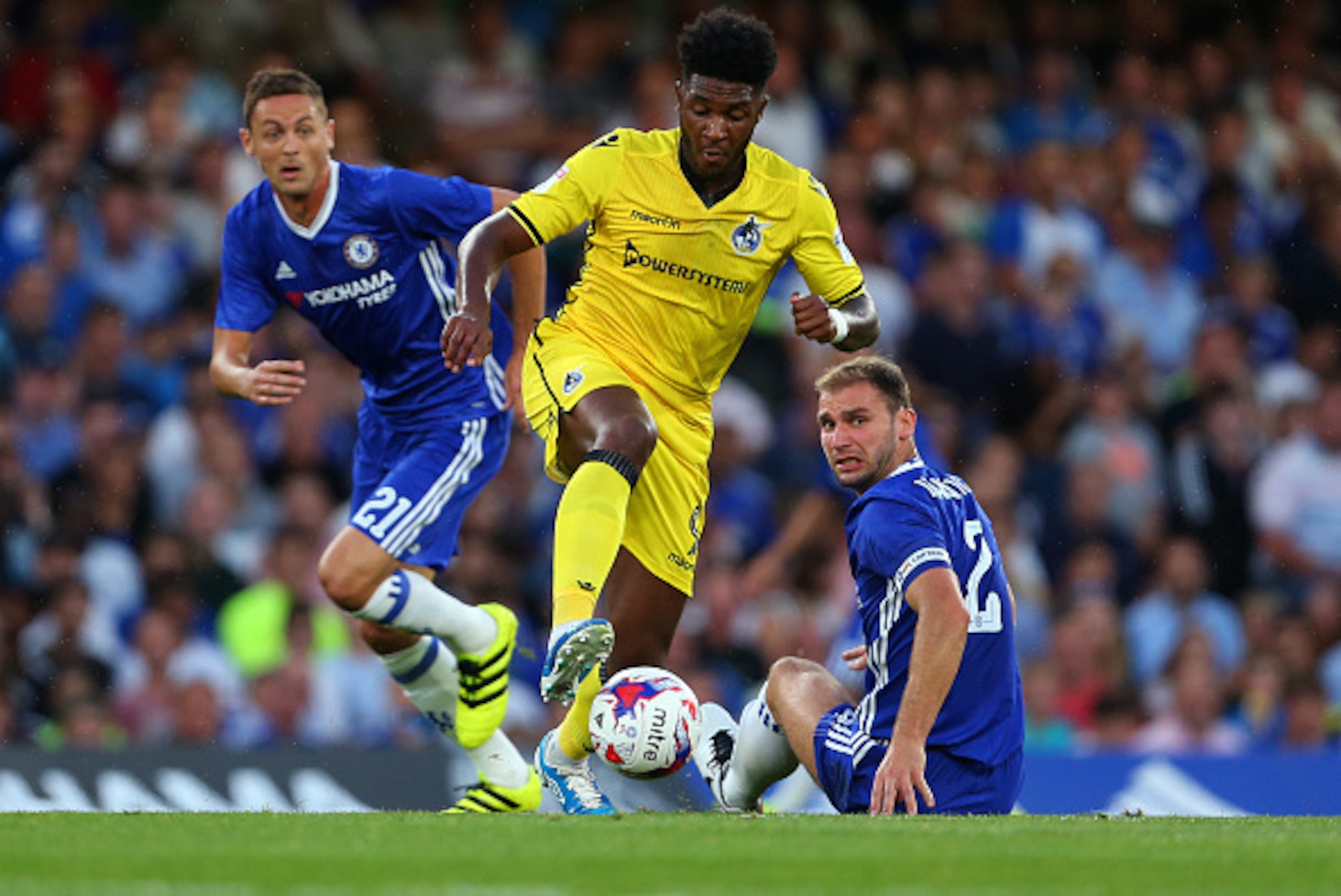 LONDON, ENGLAND - AUGUST 23: Ellie Harrison of Bristol Rovers leaves behind Nemanja Matic and Branislav Ivanovic of Chelsea during the EFL Cup match between Chelsea and Bristol Rovers at Stamford Bridge on August 23, 2016 in London, England. (Photo by Cat