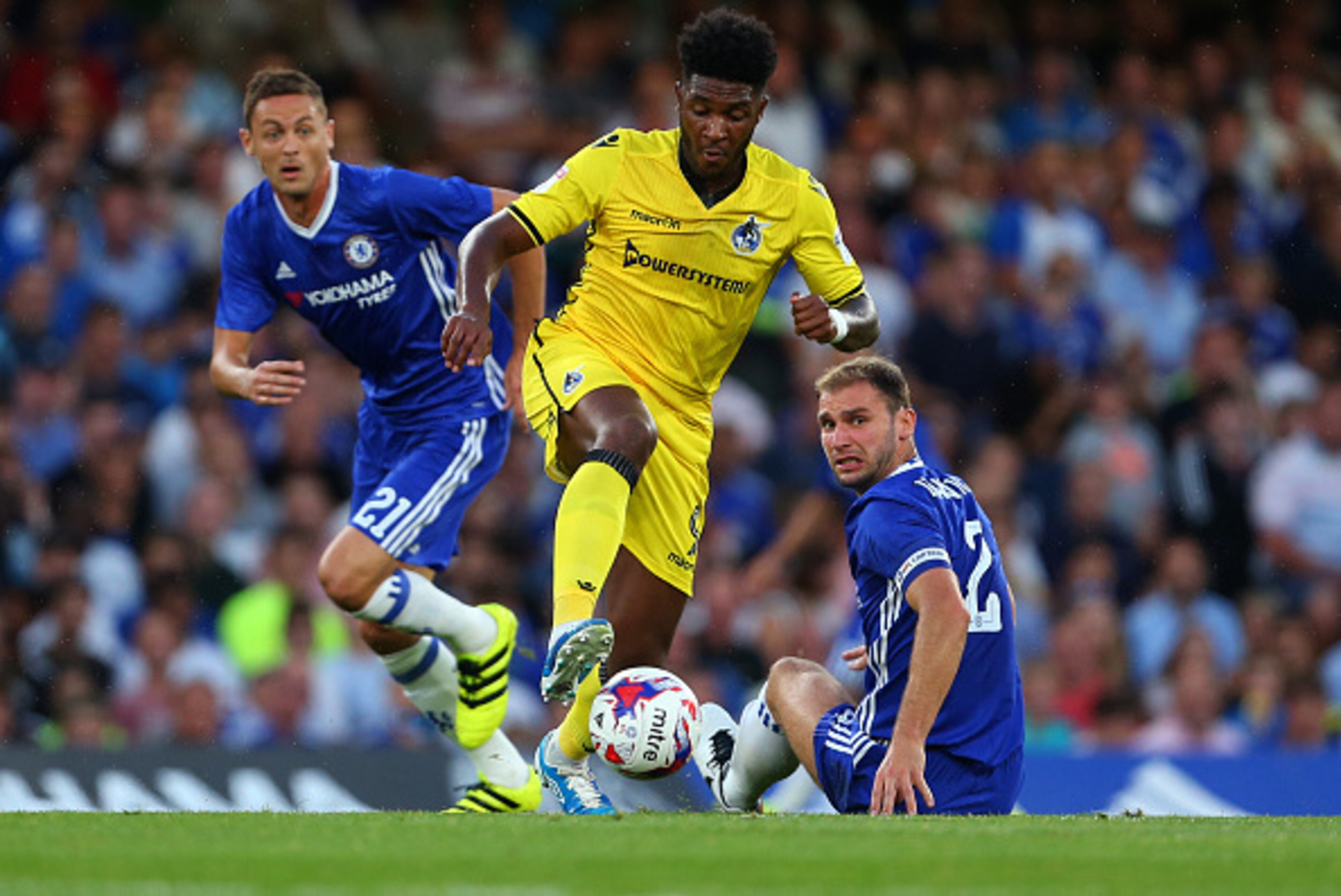 LONDON, ENGLAND - AUGUST 23: Ellie Harrison of Bristol Rovers leaves behind Nemanja Matic and Branislav Ivanovic of Chelsea during the EFL Cup match between Chelsea and Bristol Rovers at Stamford Bridge on August 23, 2016 in London, England. (Photo by Cat