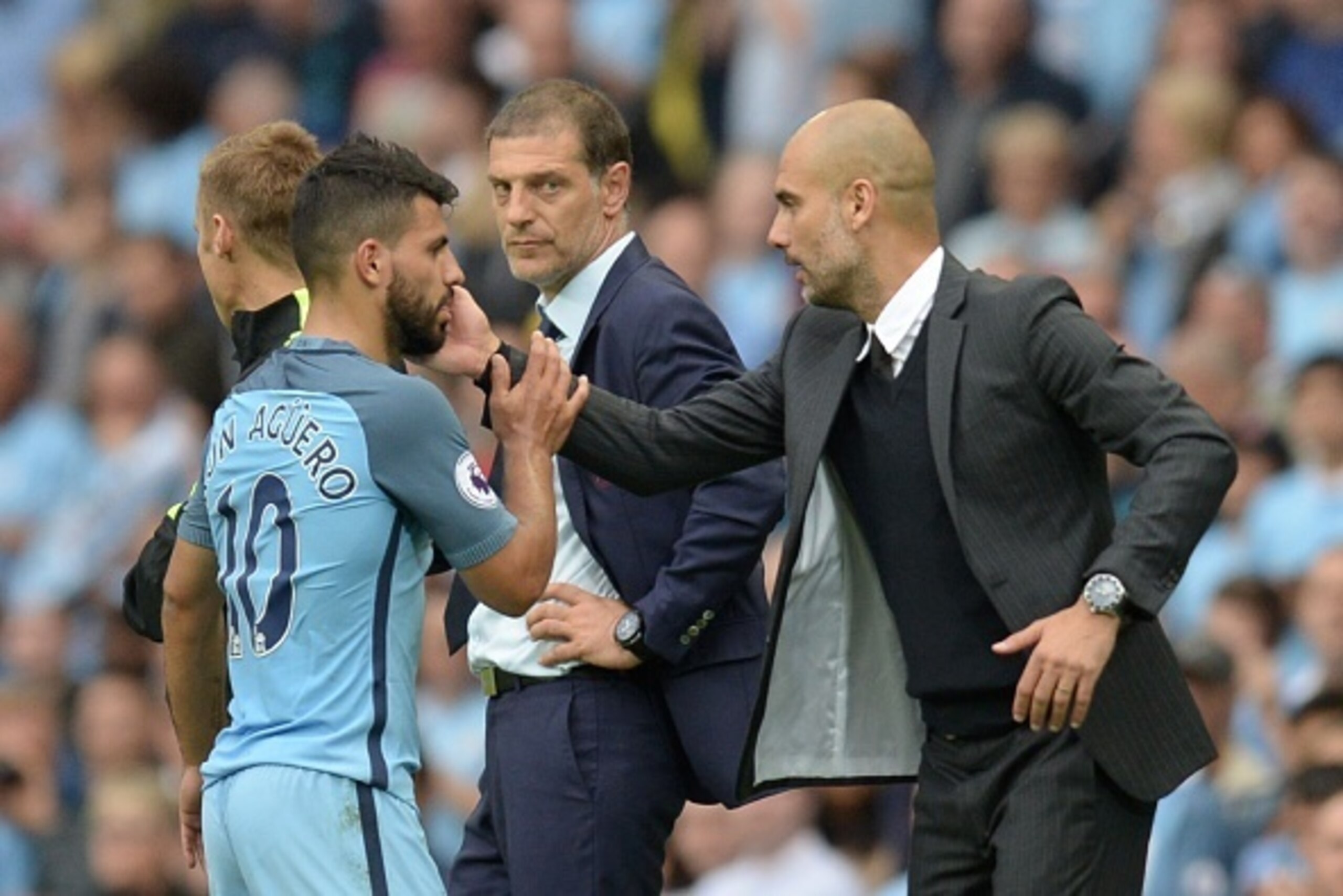 Manchester City's Spanish manager Pep Guardiola (R) greets Manchester City's Argentinian striker Sergio Aguero after he was substituted during the English Premier League football match between Manchester City and West Ham United at the Etihad Stadium in M