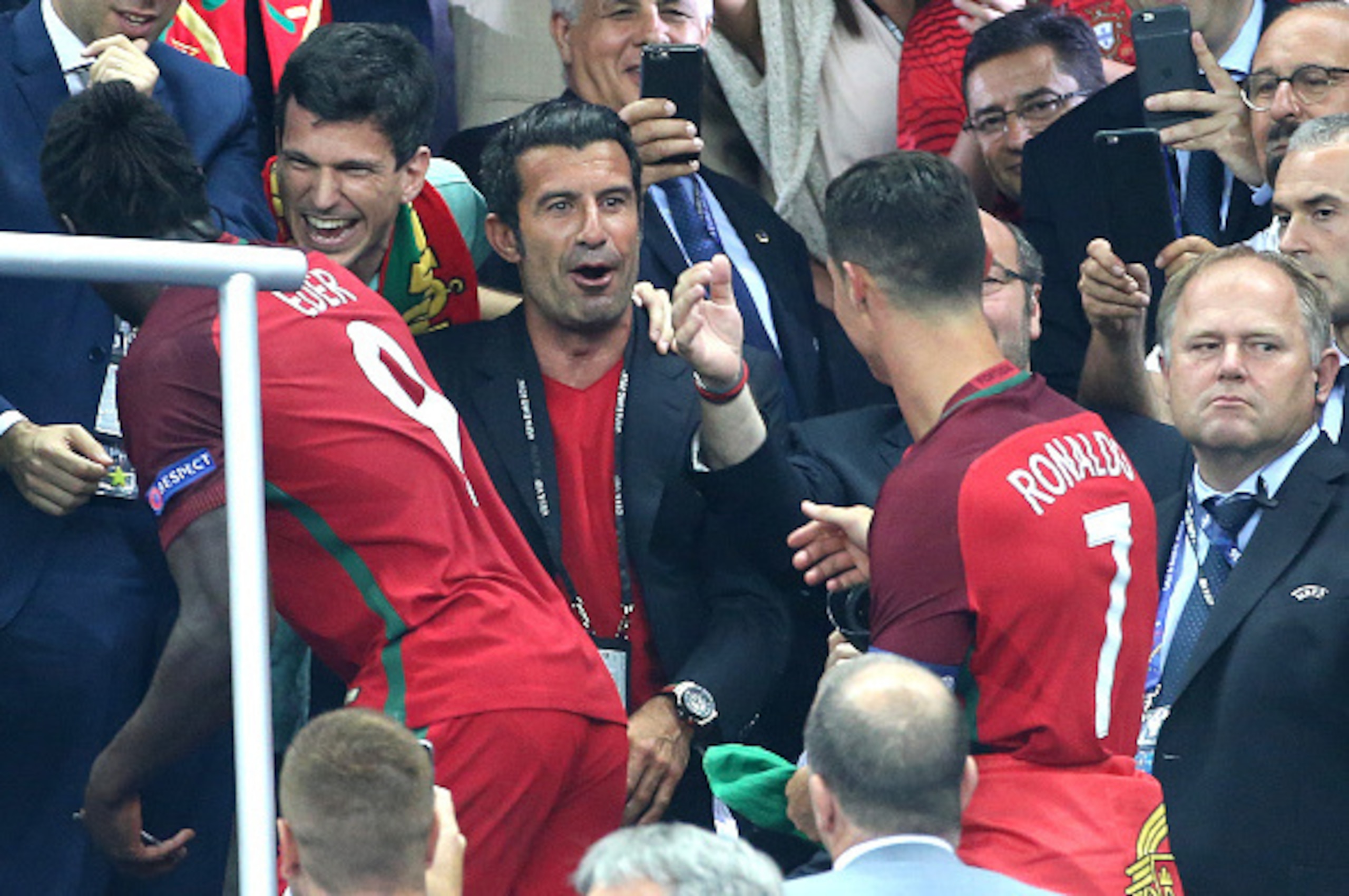 PARIS, FRANCE - JULY 10: Luis Figo greets Cristiano Ronaldo of Portugal during the trophy ceremony of the UEFA Euro 2016 final between Portugal and France at Stade de France on July 10, 2016 in Saint-Denis near Paris, France. (Photo by Jean Catuffe/Getty 