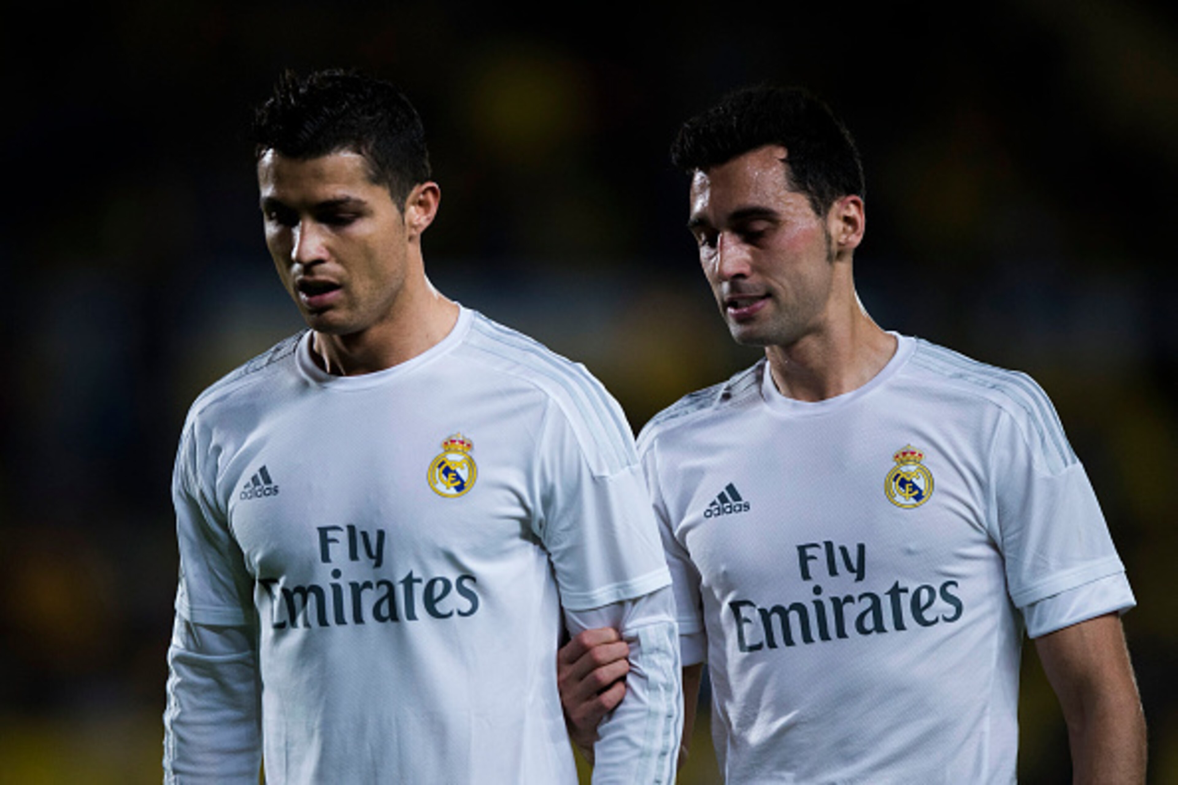 LAS PALMAS, SPAIN - MARCH 13:  Alvaro Arbeloa (R) of Real Madrid CF holds his teammate Cristiano Ronaldo (L) from the arm as they walk to the dressing room after the first half during the La Liga match between UD Las Palmas and Real Madrid CF at Estadio d