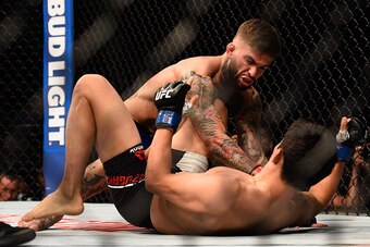 LAS VEGAS, NV - AUGUST 20:  Cody Garbrandt fights Takeya Mizugaki of Japan in their bantamweight bout during the UFC 202 event at T-Mobile Arena on August 20, 2016 in Las Vegas, Nevada.  (Photo by Jeff Bottari/Zuffa LLC/Zuffa LLC via Getty Images)