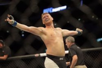 Jul 13, 2016; Sioux Falls, SD, USA;  Sam Alvey (blue gloves) reacts after defeating Eric Spicely (not pictured) during UFC Fight Night at Denny Sanford Premier Center. Mandatory Credit: Brad Rempel-USA TODAY Sports