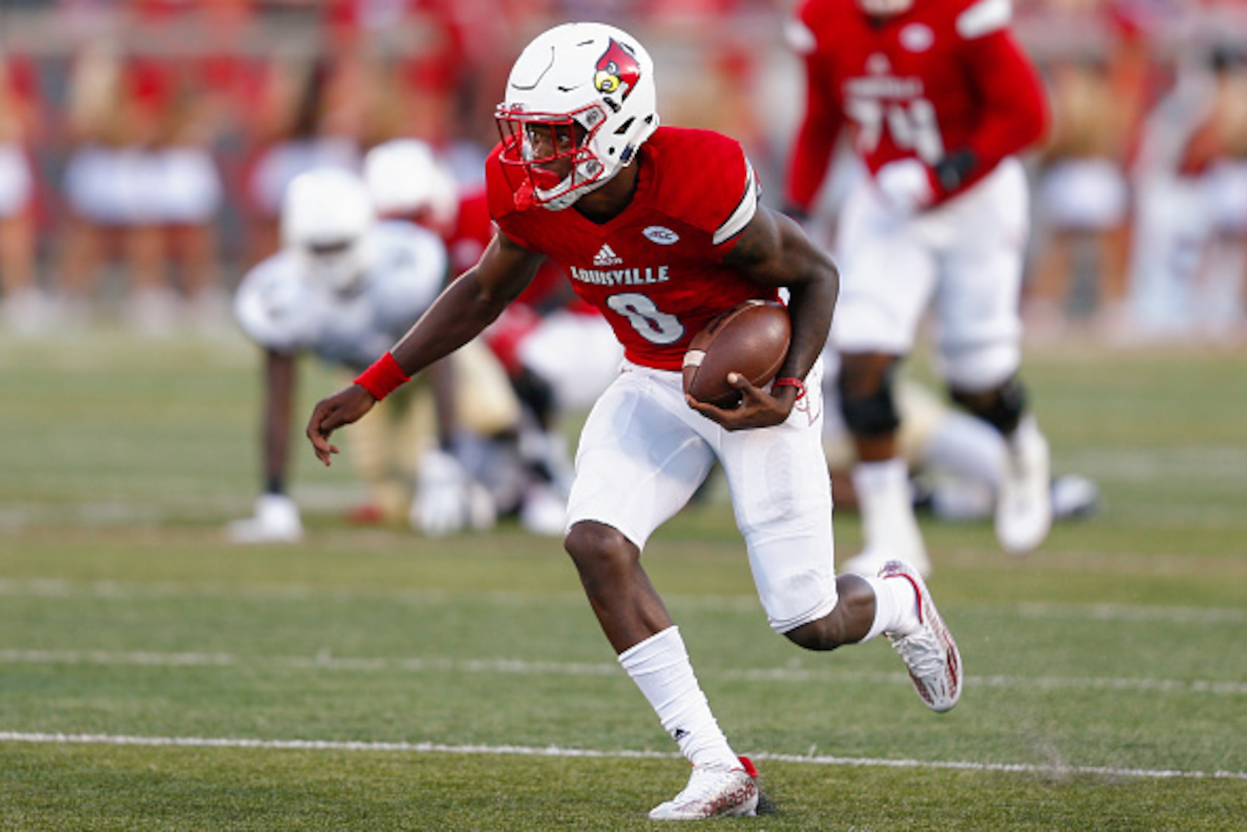 LOUISVILLE, KY - SEPTEMBER 01: Lamar Jackson #8 of the Louisville Cardinals runs the ball during the game against the Charlotte 49ers at Papa John's Cardinal Stadium on September 1, 2016 in Louisville, Kentucky. Louisville defeated Charlotte 70-14. (Photo