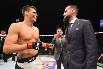 LAS VEGAS, NV - FEBRUARY 06:  (R-L) Phil 'CM Punk' Brooks faces off with Mickey Gall after Gall's victory over Mike Jackson during the UFC Fight Night event at MGM Grand Garden Arena on February 6, 2016 in Las Vegas, Nevada.  (Photo by Jeff Bottari/Zuffa 
