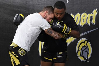 MILWAUKEE, WI - AUGUST 29:  CM Punk (L) spars with Mike 'Biggie' Rhodes (R) during a training session at Roufusport Martial Arts Academy on August 29, 2016 in Milwaukee, Wisconsin.  (Photo by Stacy Revere/ Zuffa LLC/Zuffa LLC via Getty Images)