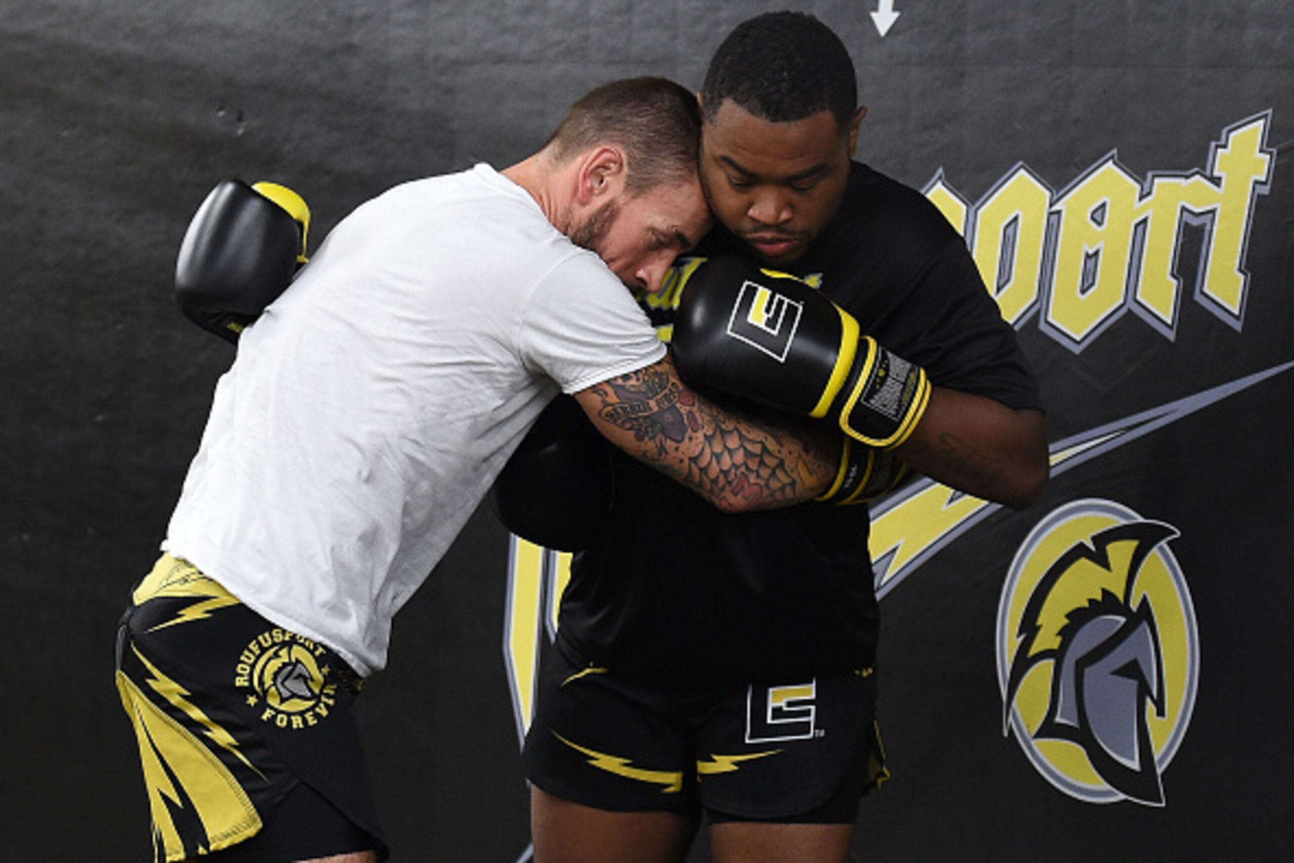 MILWAUKEE, WI - AUGUST 29:  CM Punk (L) spars with Mike 'Biggie' Rhodes (R) during a training session at Roufusport Martial Arts Academy on August 29, 2016 in Milwaukee, Wisconsin.  (Photo by Stacy Revere/ Zuffa LLC/Zuffa LLC via Getty Images)