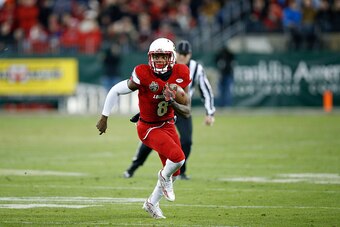 NASHVILLE, TN - DECEMBER 30: Lamar Jackson #8 of the Louisville Cardinals runs the ball against the Texas A&M Aggies during the Franklin American Mortgage Music City Bowl at Nissan Stadium on December 30, 2015 in Nashville, Tennessee. Louisville defeated 