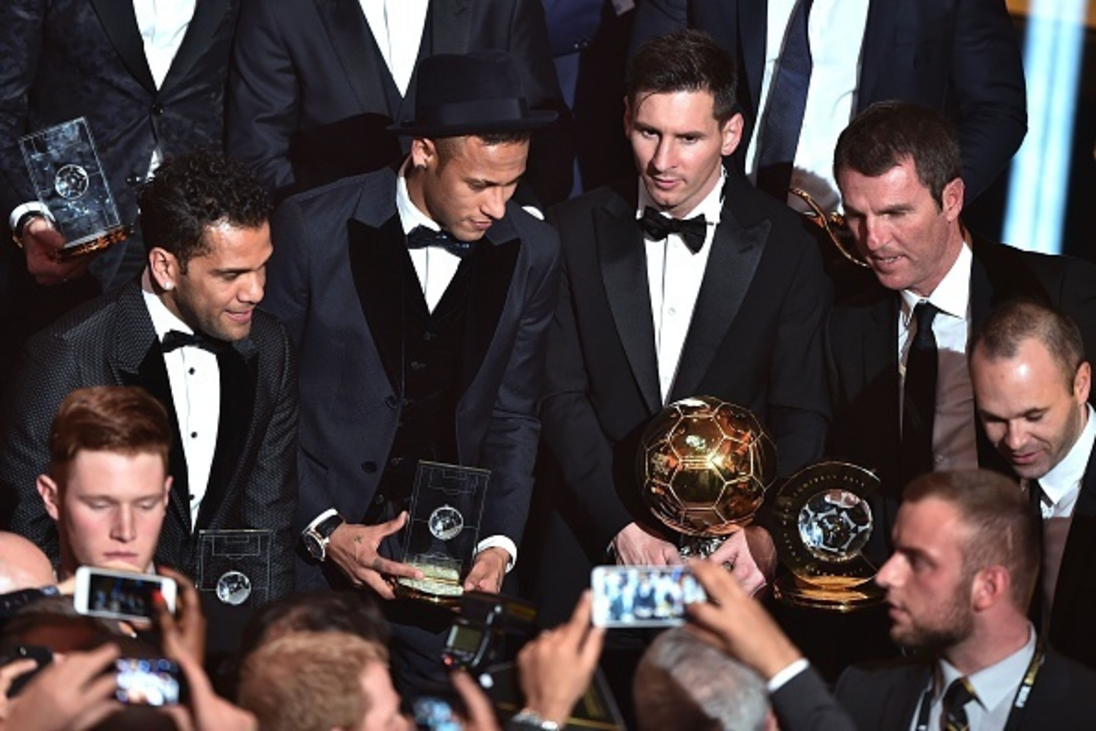 (From L) Brazil and FC Barcelona defender Dani Alves, Brazil and FC Barcelona forward Neymar, Argentina and FC Barcelona forward Lionel Messi, FC Barcelona technical director Robert Fernandez and Spain and FC Barcelona midfielder Andres Iniesta pose at th