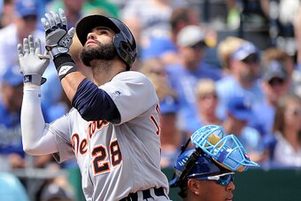 KANSAS CITY, MO - SEPTEMBER 4: J.D. Martinez #28 of the Detroit Tigers crosses home past Salvador Perez #13 of the Kansas City Royals as he celebrates his home run in the fourth inning at Kauffman Stadium on September 4, 2016 in Kansas City, Missouri. (Ph