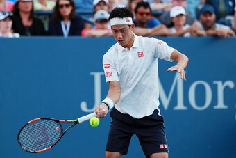NEW YORK, NY - SEPTEMBER 05:  Kei Nishikori of Japan returns a shot to Ivo Karlovic of Croatia during his fourth round Men's Singles match on Day Eight of the 2016 US Open at the USTA Billie Jean King National Tennis Center on September 5, 2016 in the Flu
