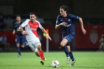 MONACO, MONACO - AUGUST 28: Joao Moutinho of Monaco and Adrien Rabiot of PSG in action during the French Ligue 1 match between AS Monaco (ASM) and Paris Saint-Germain (PSG) at Stade Louis II on August 28, 2016 in Monaco, Monaco. (Photo by Jean Catuffe/Get