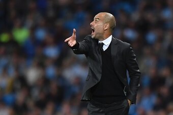 Manchester City's Spanish manager Pep Guardiola gestures from the touchlien during the UEFA Champions league second leg play-off football match between Manchester City and Steaua Bucharest at the Etihad Stadium in Manchester, north west England on August 