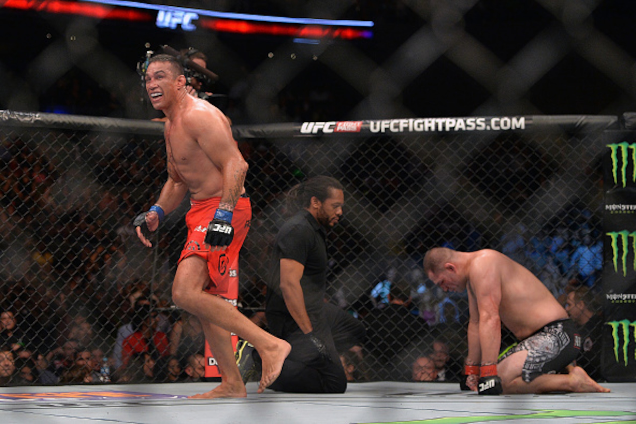 MEXICO CITY, MEXICO - JUNE 13:  (L-R) Fabricio Werdum of Brazil celebrates after defeating Cain Velasquez of the United States in their UFC heavyweight championship bout during the UFC 188 event inside the Arena Ciudad de Mexico on June 13, 2015 in Mexico