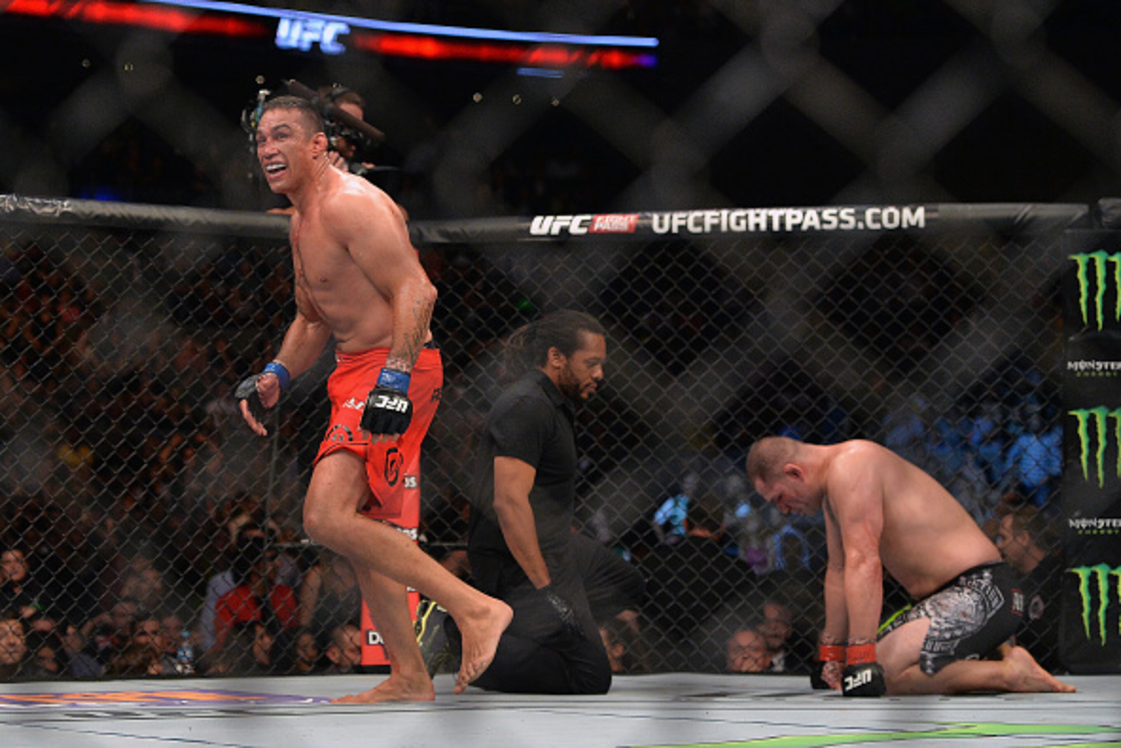 MEXICO CITY, MEXICO - JUNE 13:  (L-R) Fabricio Werdum of Brazil celebrates after defeating Cain Velasquez of the United States in their UFC heavyweight championship bout during the UFC 188 event inside the Arena Ciudad de Mexico on June 13, 2015 in Mexico