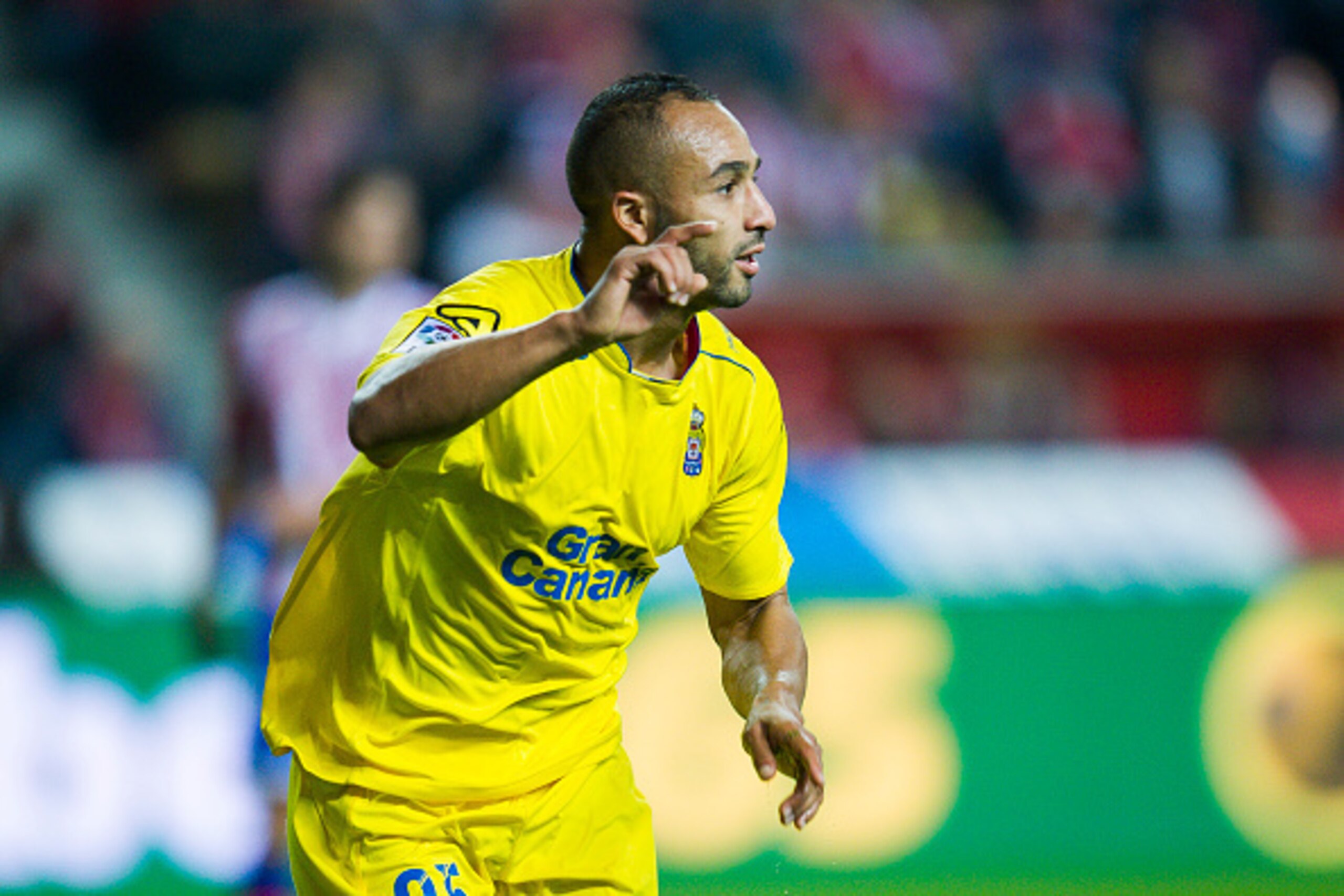GIJON, SPAIN - DECEMBER 06: Nabil El Zhar of UD Las Plamas celebrates after scoring goal during the La Liga match between Real Sporting de Gijon and UD Las Plamas at Estadio El Molinon on December 6, 2015 in Gijon, Spain. (Photo by Juan Manuel Serrano GIJON, SPAIN - DECEMBER 06: Nabil El Zhar of UD Las Plamas celebrates after scoring goal during the La Liga match between Real Sporting de Gijon and UD Las Plamas at Estadio El Molinon on December 6, 2015 in Gijon, Spain. (Photo by Juan Manuel Serrano