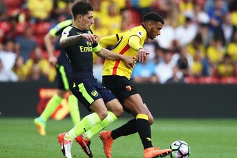 WATFORD, ENGLAND - AUGUST 27: Hector Bellerin of Arsenal (L) puts presure on Etienne Capoue of Watford (R) during the Premier League match between Watford and Arsenal at Vicarage Road on August 27, 2016 in Watford, England.  (Photo by David Rogers/Getty I