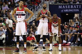 WASHINGTON, DC - MARCH 23: Otto Porter Jr. #22, Markieff Morris #5 and John Wall #2 of the Washington Wizards look on in the closing mintues of their 122-101 loss to the Atlanta Hawks at Verizon Center on March 23, 2016 in Washington, DC. NOTE TO USER: Us