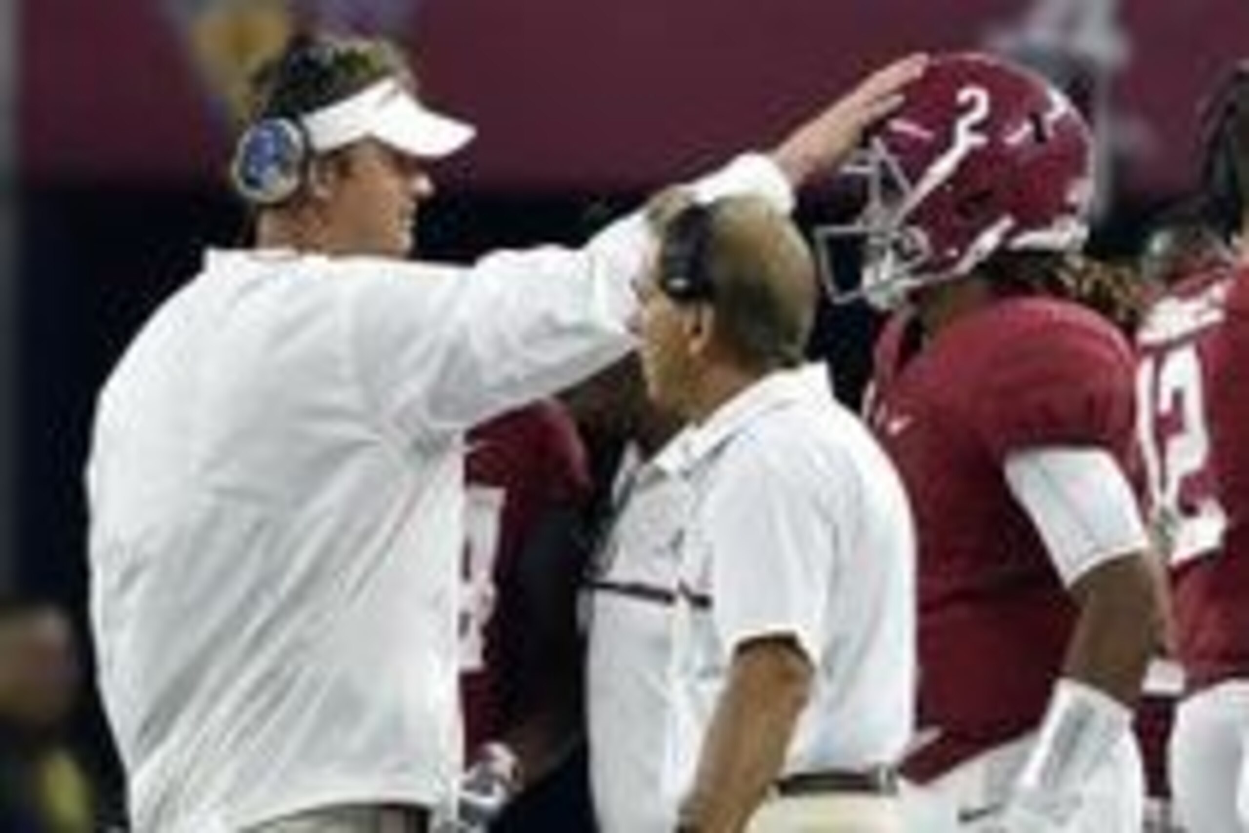 Sep 3, 2016; Arlington, TX, USA; Alabama Crimson Tide offensive coordinator Lane Kiffin taps quarterback Jalen Hurts (2) on the head in front of head coach Nick Saban during the second half against the USC Trojans at AT&T Stadium. Mandatory Credit: Jerome