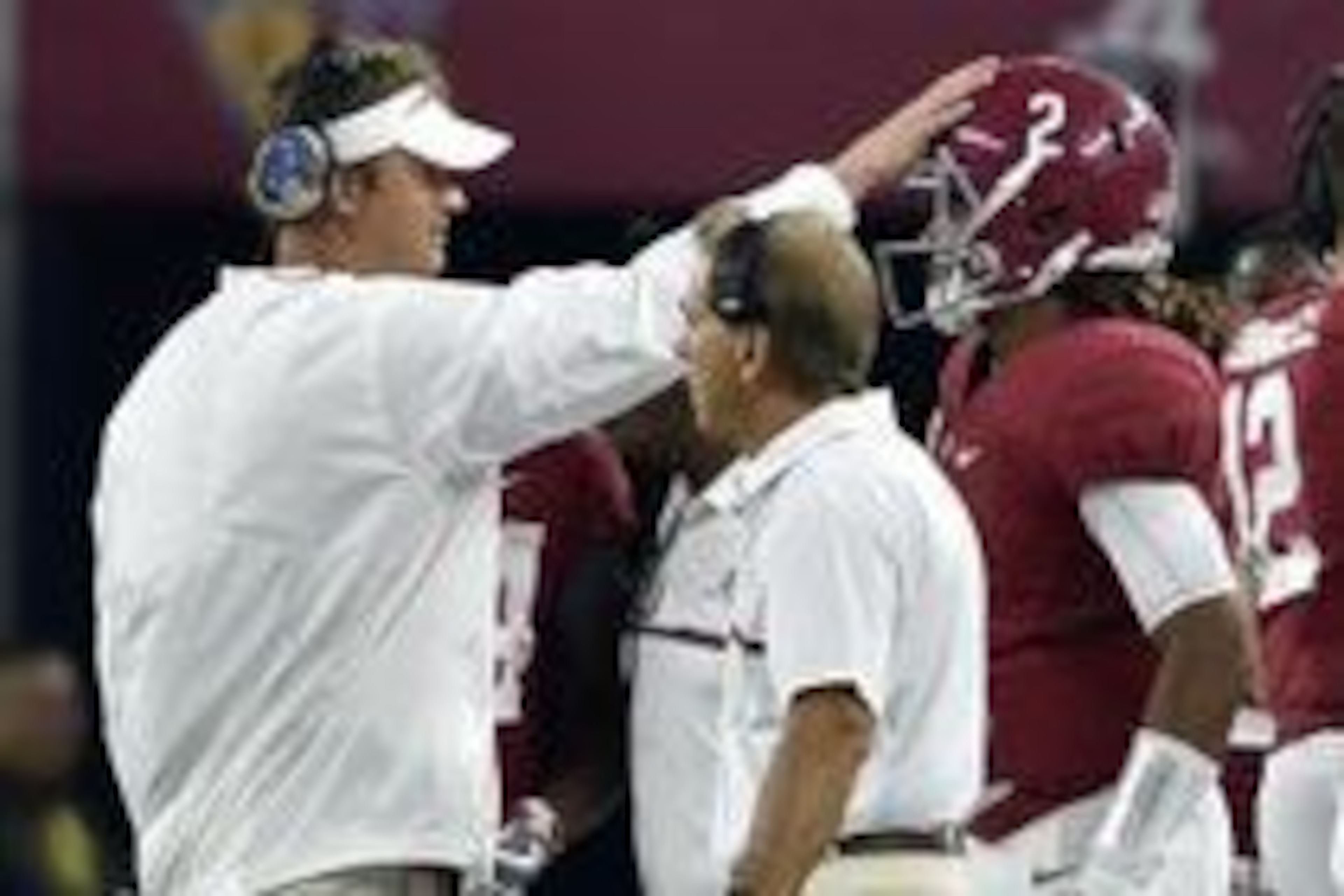 Sep 3, 2016; Arlington, TX, USA; Alabama Crimson Tide offensive coordinator Lane Kiffin taps quarterback Jalen Hurts (2) on the head in front of head coach Nick Saban during the second half against the USC Trojans at AT&T Stadium. Mandatory Credit: Jerome