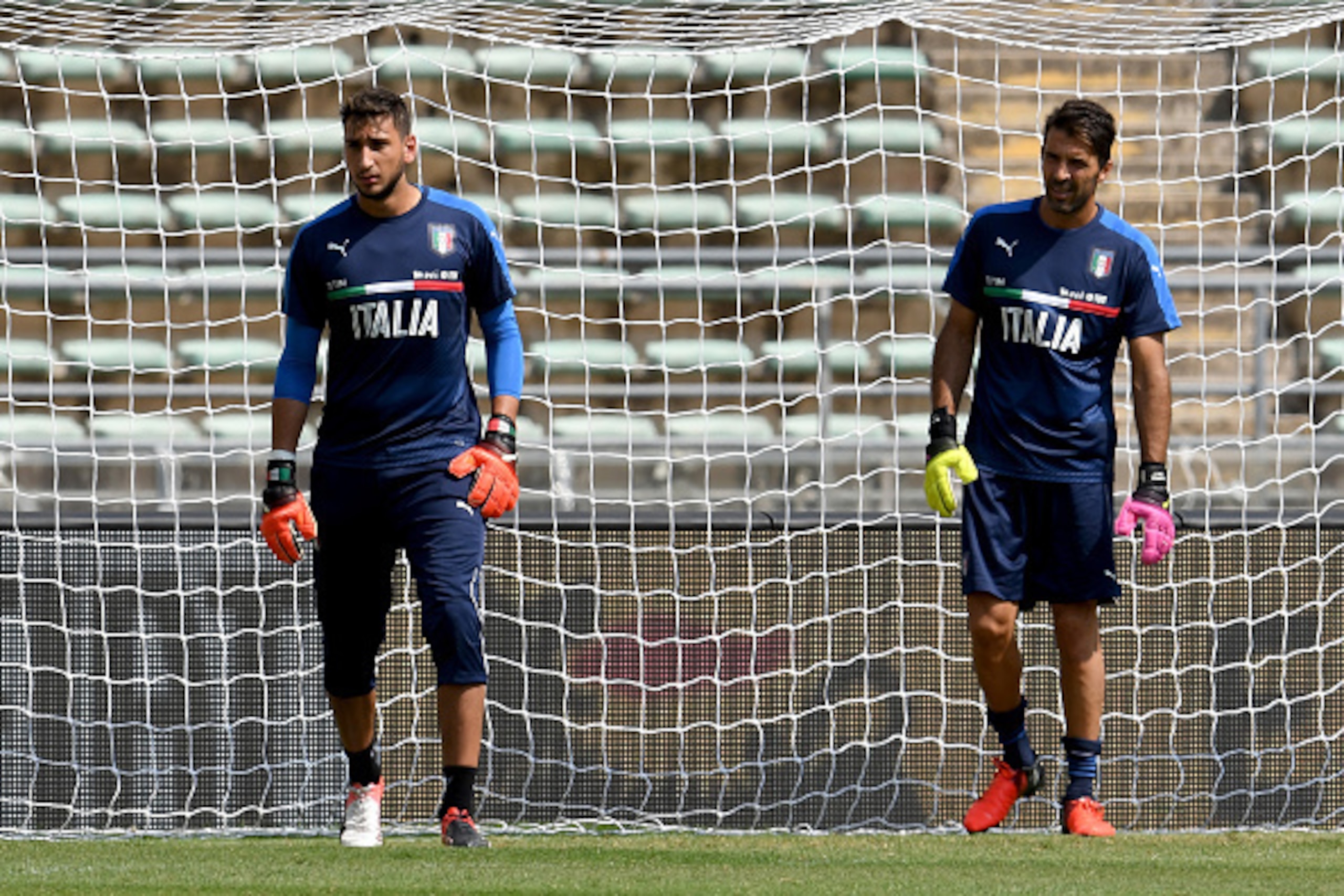 BARI, ITALY - SEPTEMBER 03:  Gianluigi Donnarumma (L) and Gianluigi Buffon of Italy look on during the Italy training session at Stadio San Nicola on September 3, 2016 in Bari, Italy.  (Photo by Claudio Villa/Getty Images)