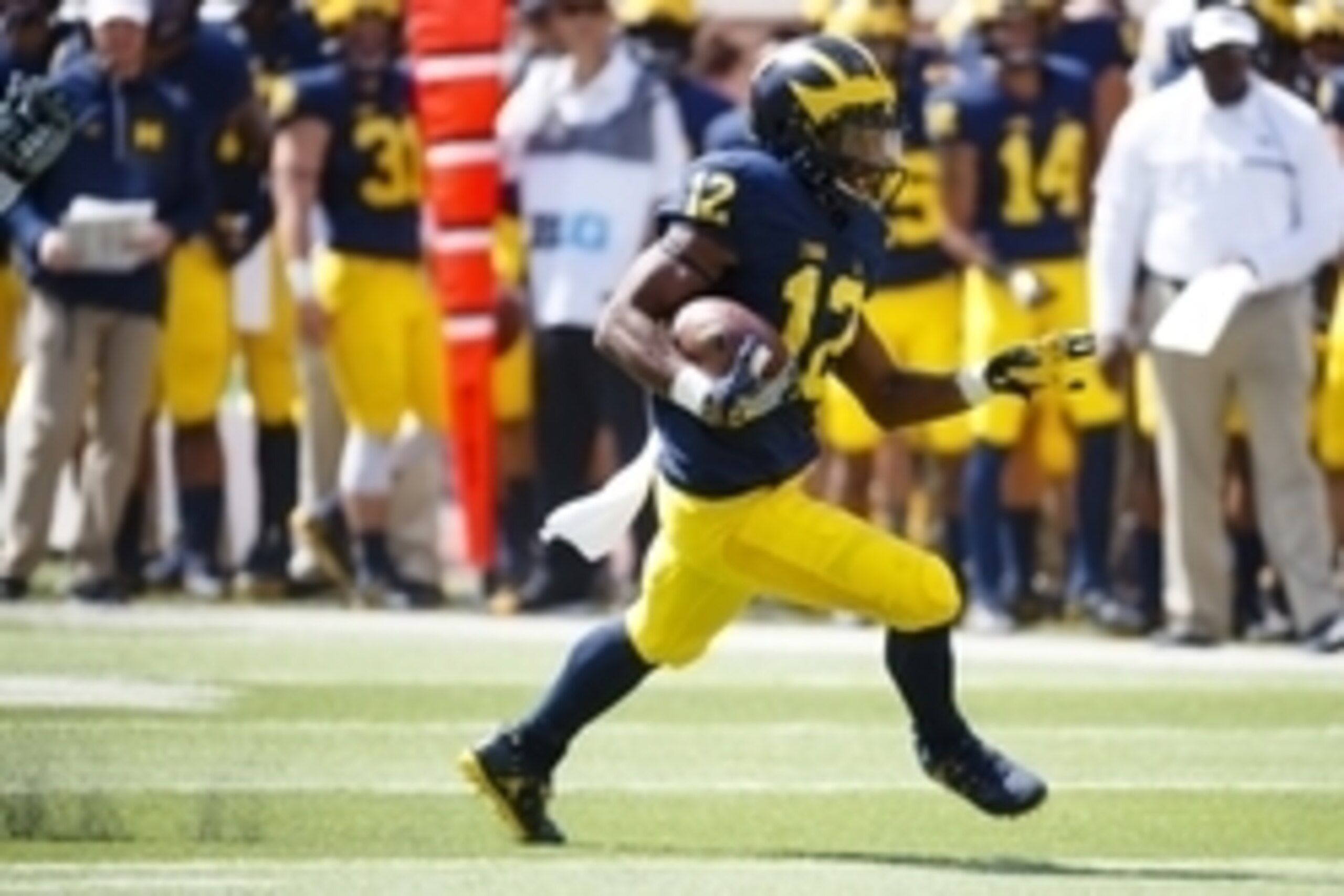 Sep 3, 2016; Ann Arbor, MI, USA; Michigan Wolverines running back Chris Evans (12) runs the ball in the second quarter against the Hawaii Warriors at Michigan Stadium. Mandatory Credit: Rick Osentoski-USA TODAY Sports