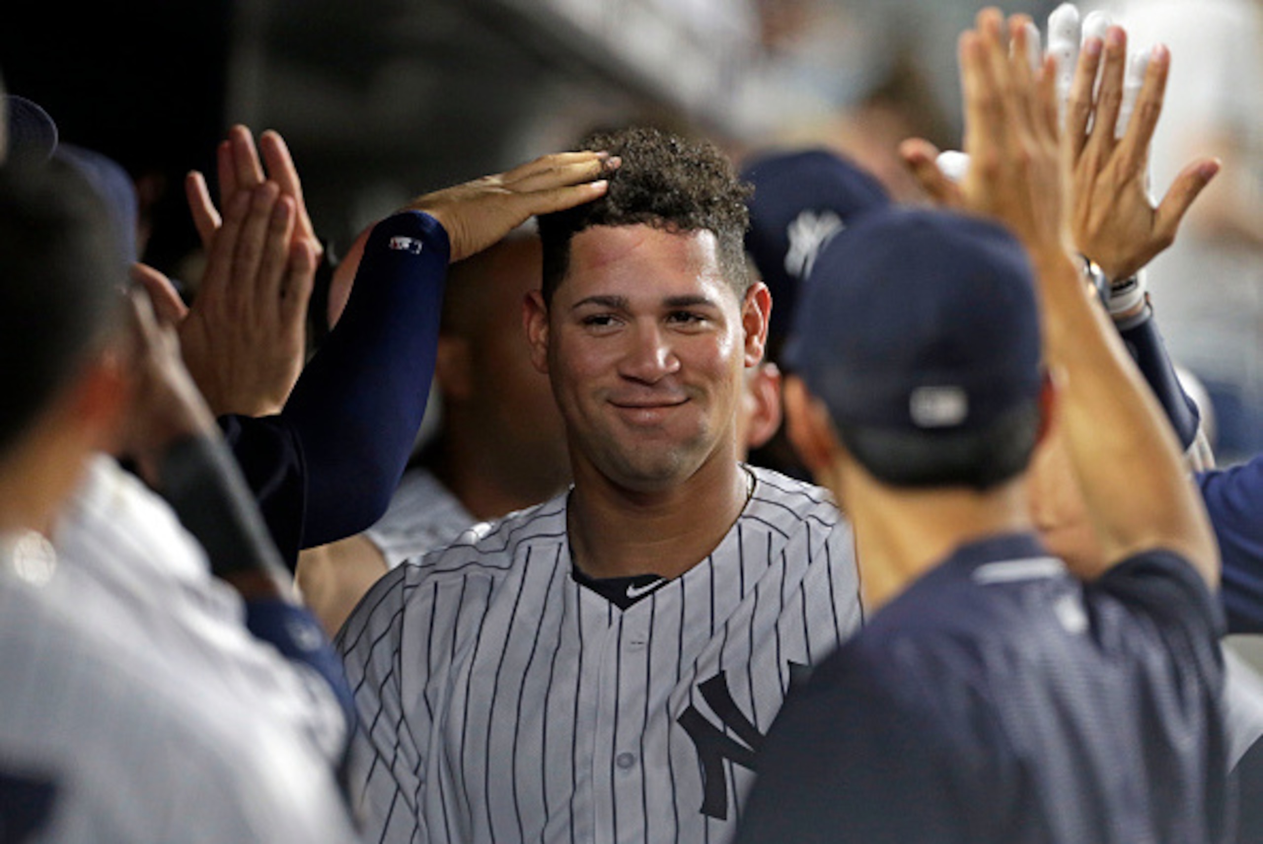 NEW YORK, NY - AUGUST 26: Gary Sanchez #24 of the New York Yankees is congratulated in the dugout after hitting a 2-run home run during the fifth inning against the Baltimore Orioles at Yankee Stadium on August 26, 2016 in the Bronx borough of New York Ci NEW YORK, NY - AUGUST 26: Gary Sanchez #24 of the New York Yankees is congratulated in the dugout after hitting a 2-run home run during the fifth inning against the Baltimore Orioles at Yankee Stadium on August 26, 2016 in the Bronx borough of New York Ci