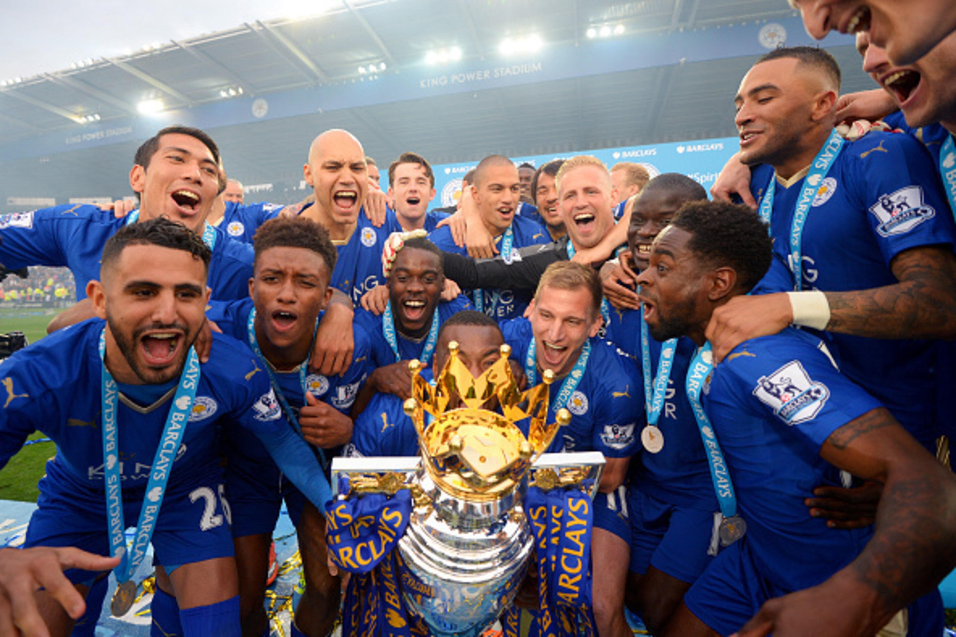 LEICESTER, ENGLAND - MAY 07: Captain Wes Morgan of Leicester City to lift the Premier League Trophy as players celebrate the season champions after the Barclays Premier League match between Leicester City and Everton at The King Power Stadium on May 7, 2 LEICESTER, ENGLAND - MAY 07: Captain Wes Morgan of Leicester City to lift the Premier League Trophy as players celebrate the season champions after the Barclays Premier League match between Leicester City and Everton at The King Power Stadium on May 7, 2