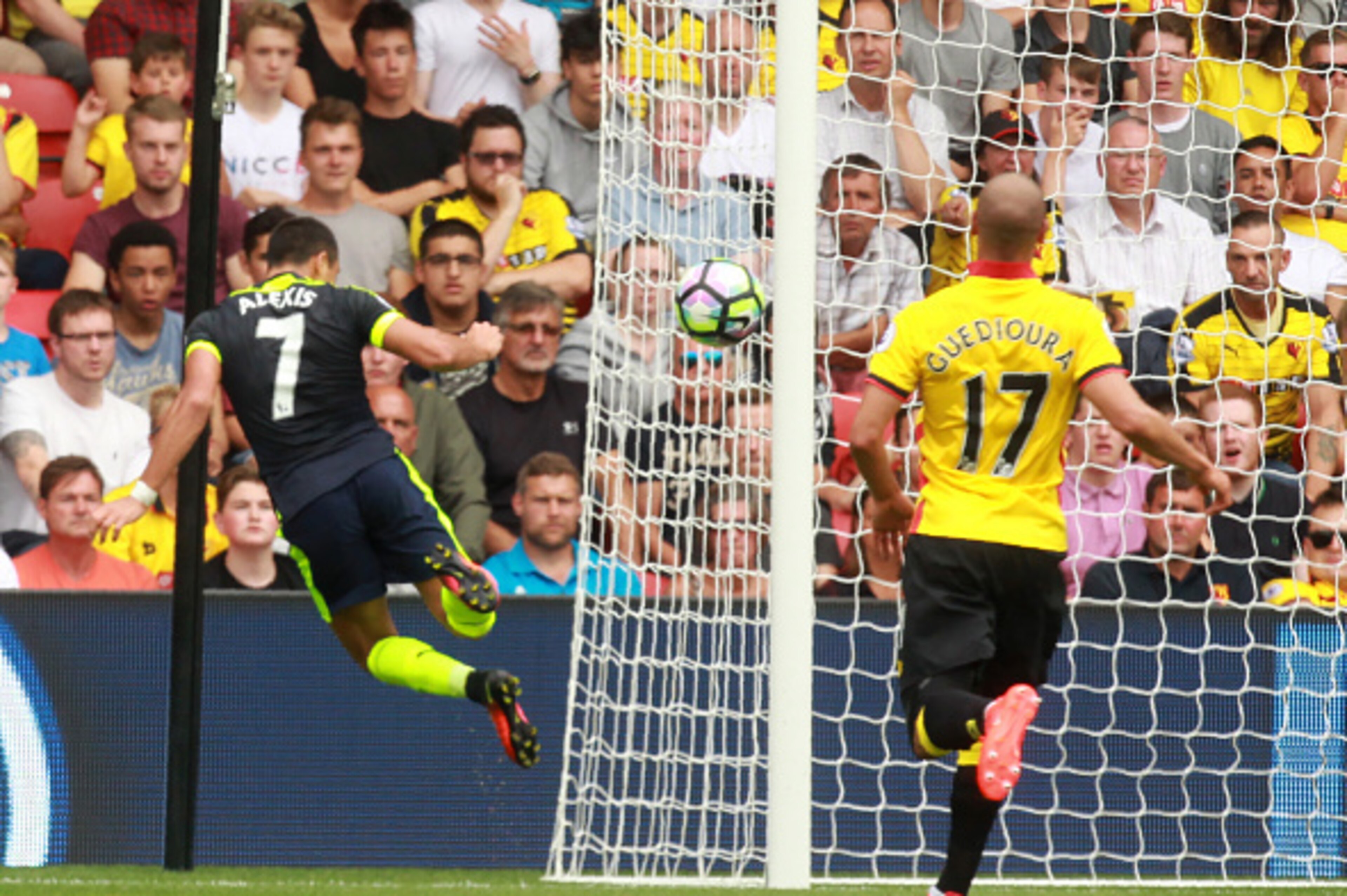 Arsenal's Chilean striker Alexis Sanchez (L) heads home their second goal during the English Premier League football match between Watford and Arsenal at Vicarage Road Stadium in Watford, north of London on August 27, 2016.
Arsenal won the game 3-1. / AFP Arsenal's Chilean striker Alexis Sanchez (L) heads home their second goal during the English Premier League football match between Watford and Arsenal at Vicarage Road Stadium in Watford, north of London on August 27, 2016.
Arsenal won the game 3-1. / AFP