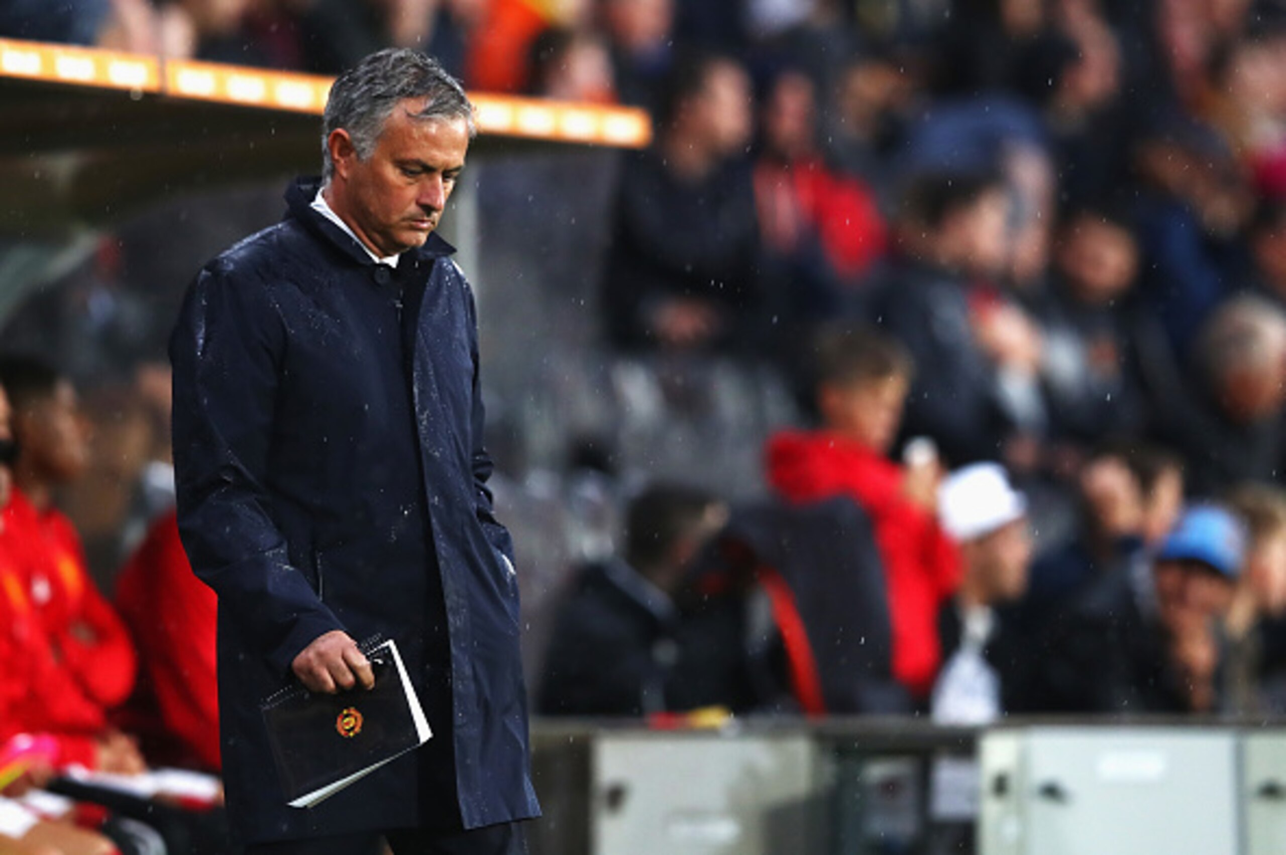 HULL, ENGLAND - AUGUST 27: Jose Mourinho, Manager of Manchester United shows dejection while getting wet in the rain during the Premier League match between Hull City and Manchester United at KCOM Stadium on August 27, 2016 in Hull, England.  (Photo by Ma