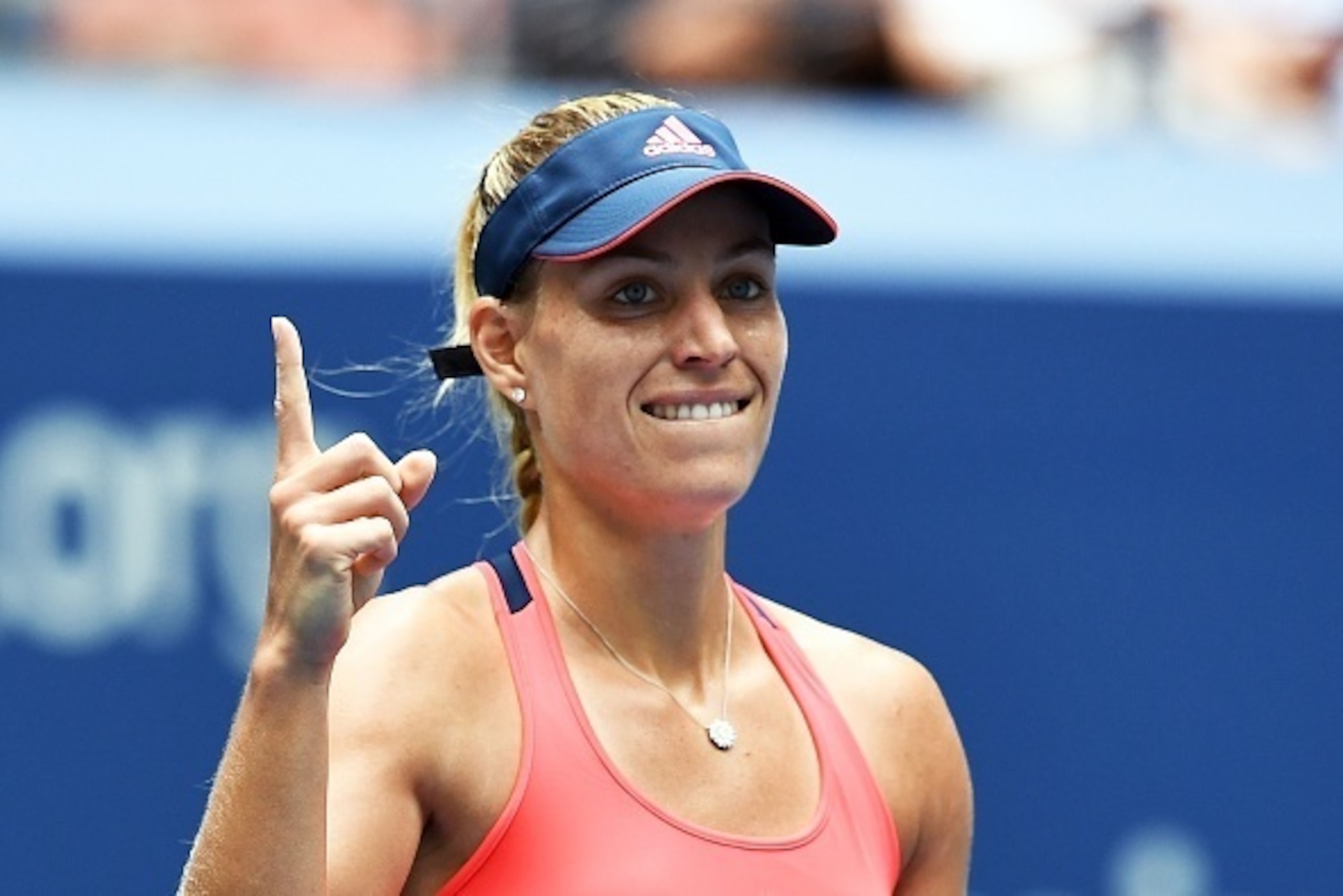 Angelique Kerber of Germany signals after winning against Roberta Vinci of Italy during their US Open 2016 women's quarterfinals match at the USTA Billie Jean King National Tennis Center in New York on September 6, 2016. / AFP / Jewel SAMAD        (Photo 