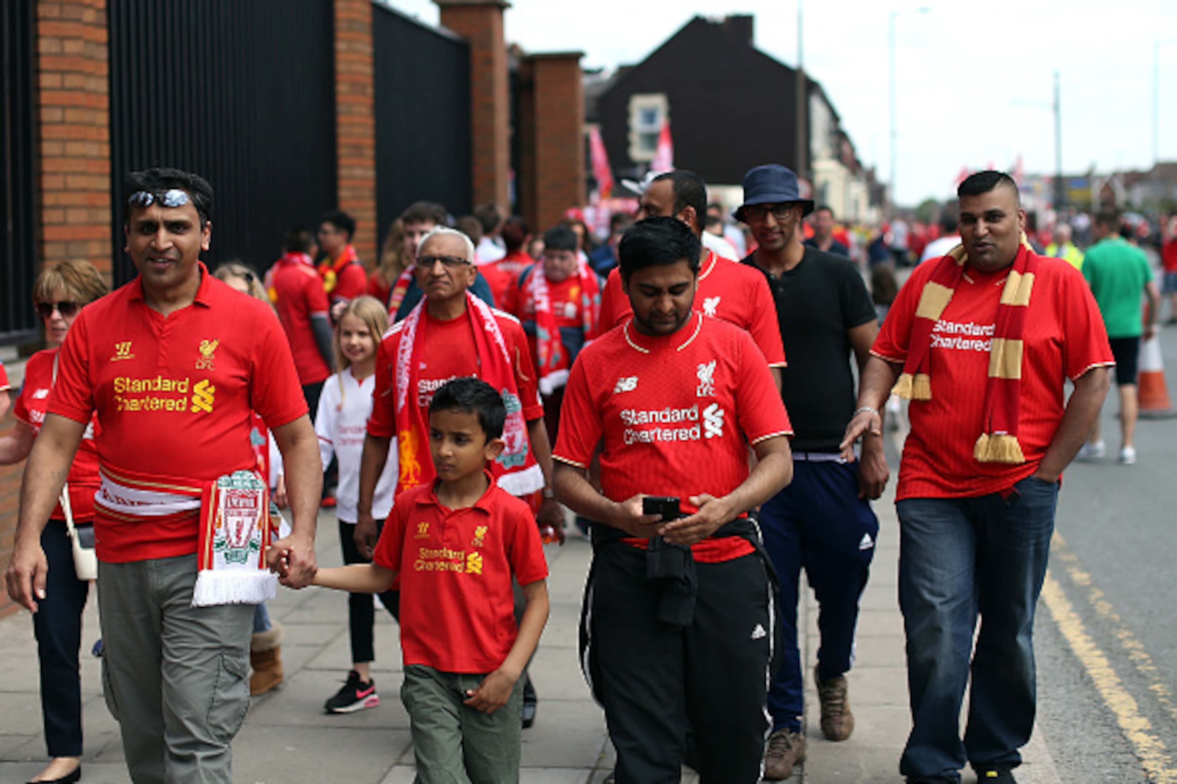 LIVERPOOL, ENGLAND - MAY 08:  Fans of Liverpool arrive for the Barclays Premier League match between Liverpool and Watford at Anfield on May 8, 2016 in Liverpool, England.  (Photo by Jan Kruger/Getty Images)