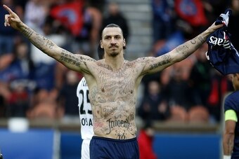 Paris Saint-Germain's Swedish forward Zlatan Ibrahimovic celebrates after scoring during the French L1 football match Paris Saint-Germain (PSG) vs Caen (SMC) at the Parc des Princes stadium in Paris on February 14, 2015. The match ended in a 2-2 draw. AFP
