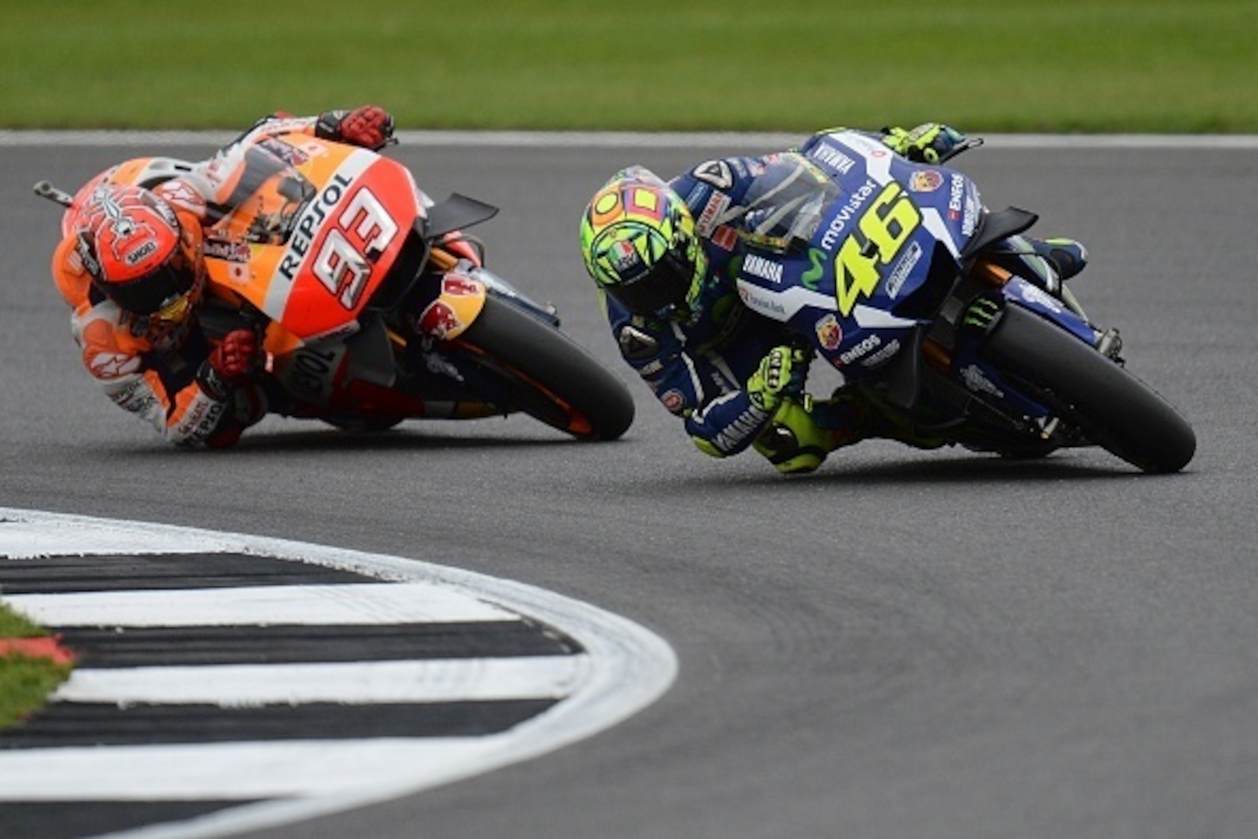 Movistar Yamaha MotoGP's Italian rider  Valentino Rossi (R) and Repsol Honda Team's Spanish rider Marc Marquez (L) during the MotoGP race at the motorcycling British Grand Prix at Silverstone circuit in Northamptonshire, southern England, on September 4, 