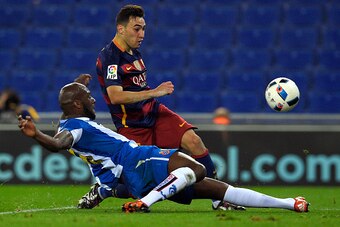 Barcelona's forward Munir El Haddadi (R) shoots to score a goal next to Espanyol's French defender Michael Ciani (L) during the Spanish Copa del Rey (King's Cup) round of 16 second leg football match RCD Espanyol vs FC Barcelona at Cornella-El Prat stadiu