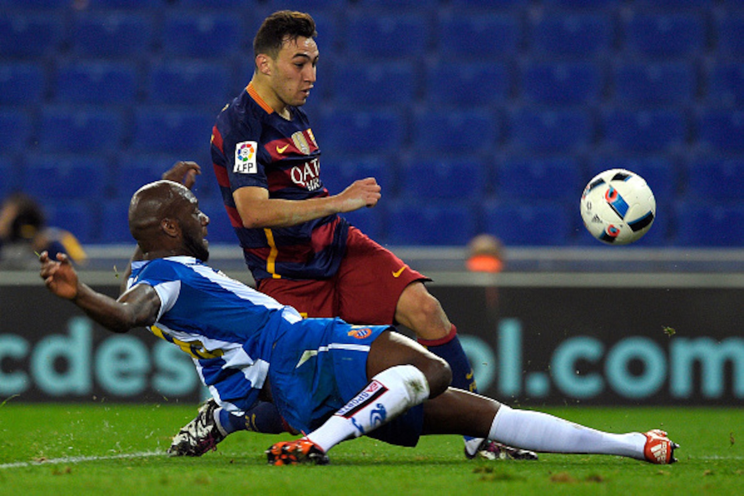 Barcelona's forward Munir El Haddadi (R) shoots to score a goal next to Espanyol's French defender Michael Ciani (L) during the Spanish Copa del Rey (King's Cup) round of 16 second leg football match RCD Espanyol vs FC Barcelona at Cornella-El Prat stadiu