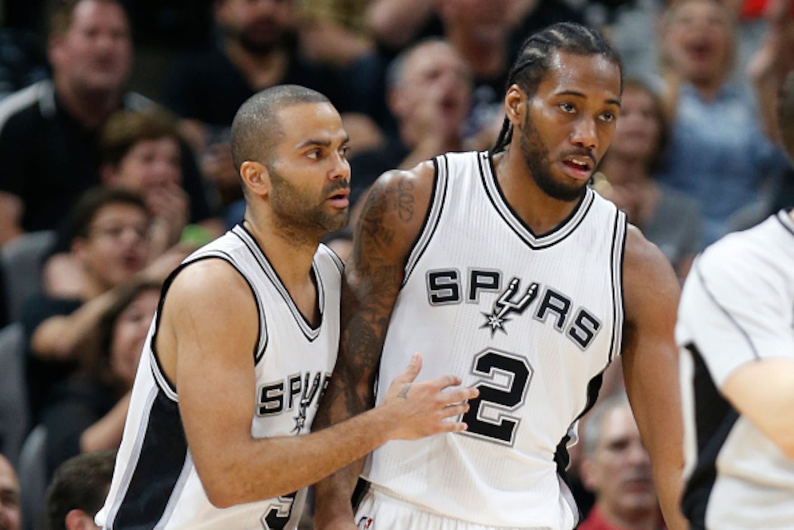 SAN ANTONIO,TX - MARCH 15: Tony Parker #9 of the San Antonio Spurs congratulates Kawhi Leonard #2 of the San Antonio Spurs after three  against the Los Angeles Clippers at AT&T Center on March 15, 2016 in San Antonio, Texas.  NOTE TO USER: User expressly 