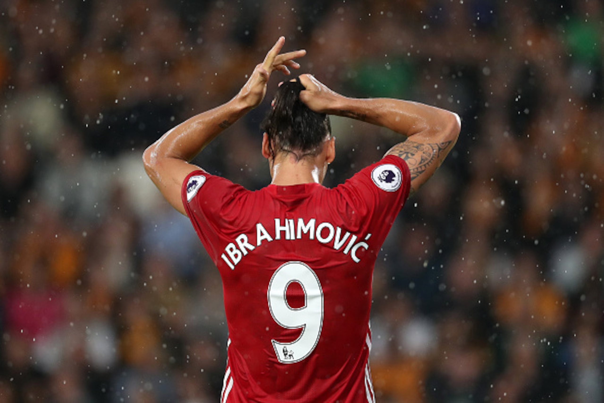 HULL, ENGLAND - AUGUST 27: Zlatan Ibrahimovic of Manchester United ties up his hair during the Premier League match between Hull City and Manchester United at KC Stadium on August 27, 2016 in Hull, England. (Photo by Matthew Ashton - AMA/Getty Images)