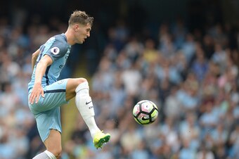 Manchester City's English defender John Stones controls the ball during the English Premier League football match between Manchester City and West Ham United at the Etihad Stadium in Manchester, north west England, on August 28, 2016. / AFP / OLI SCARFF /
