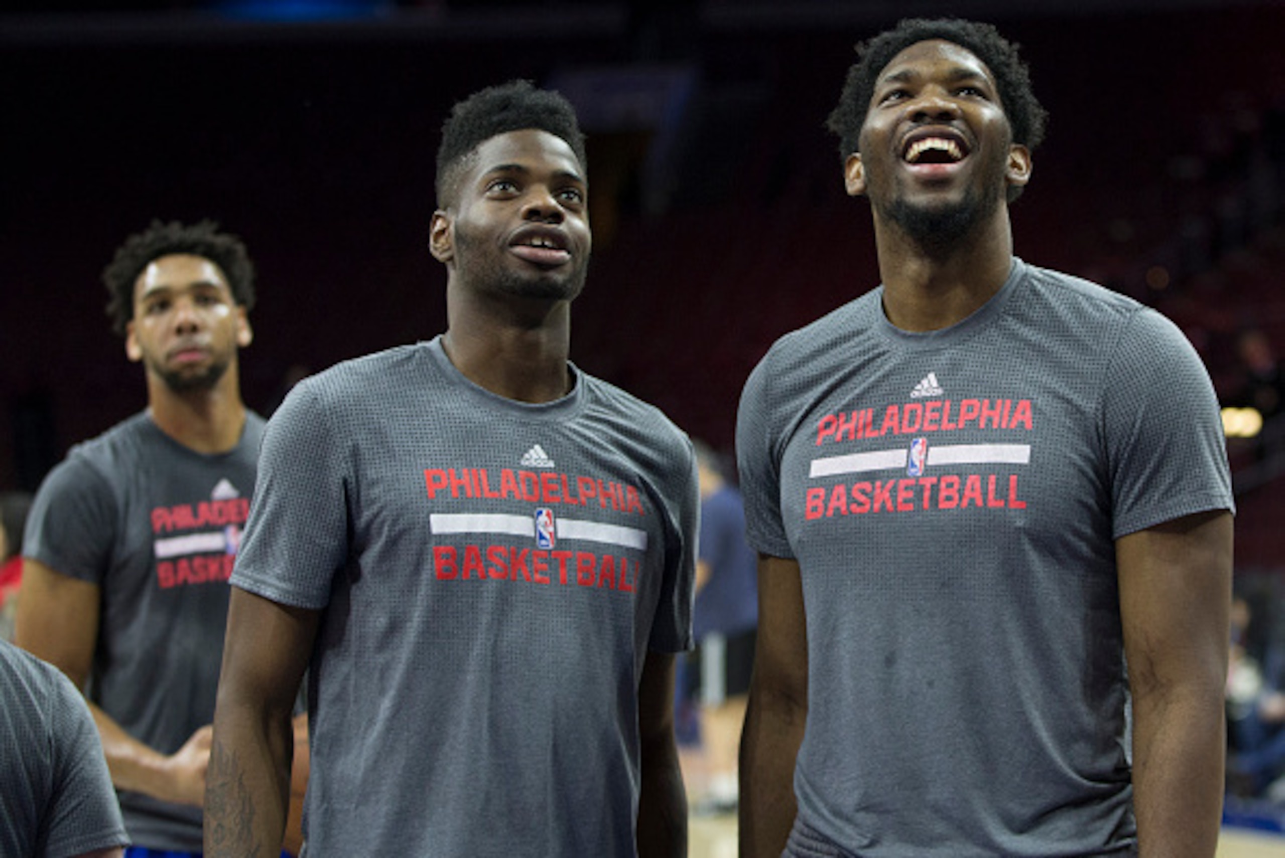 PHILADELPHIA, PA - DECEMBER 22: Jahlil Okafor #8, Nerlens Noel #4, and Joel Embiid #21 of the Philadelphia 76ers warm up prior to the game against the Memphis Grizzlies on December 22, 2015 at the Wells Fargo Center in Philadelphia, Pennsylvania. NOTE TO 