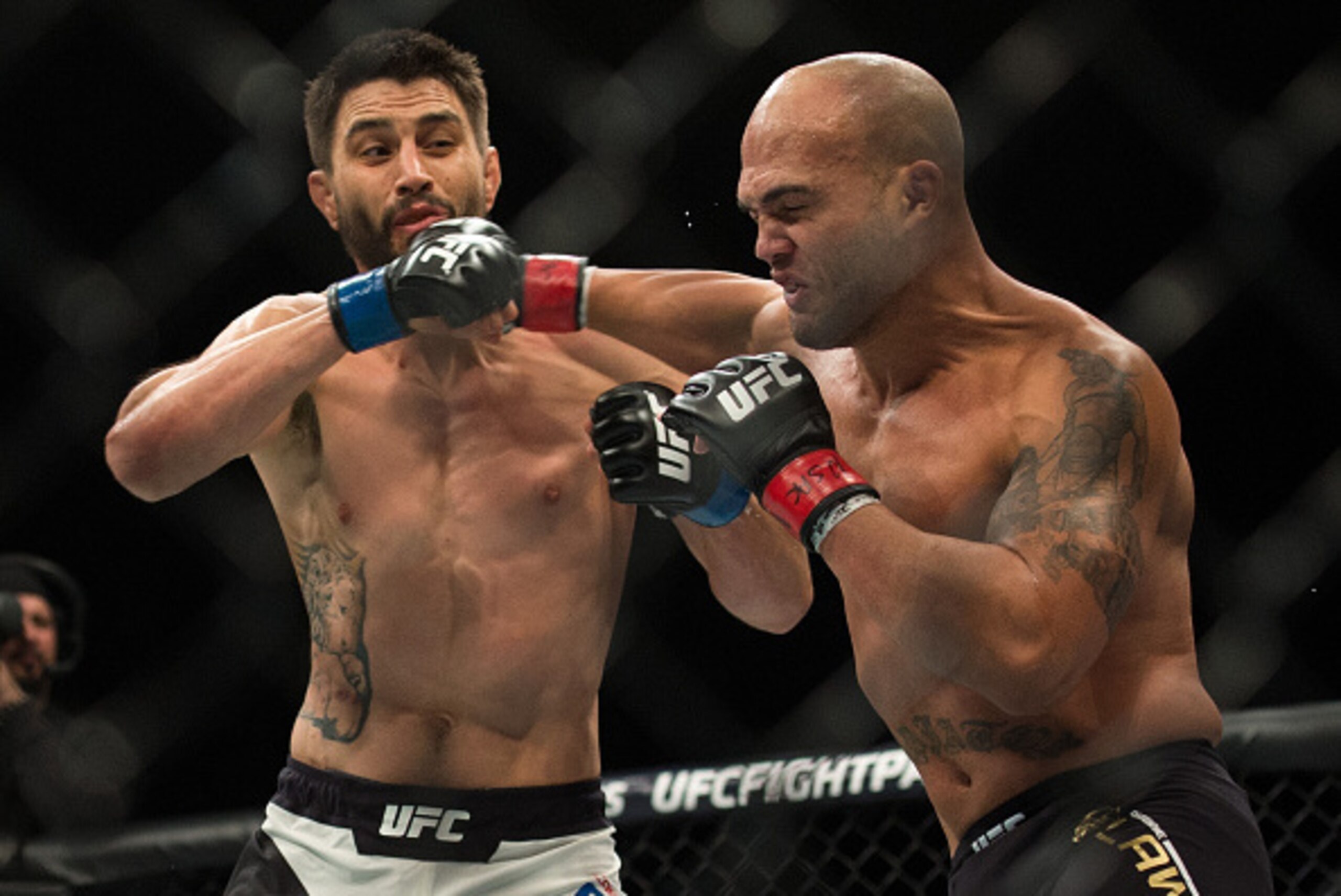 LAS VEGAS, NV - JANUARY 02:  (R-L) Robbie Lawler exchanges punches with Carlos Condit in their welterweight championship fight during the UFC 195 event inside MGM Grand Garden Arena on January 2, 2016 in Las Vegas, Nevada.  (Photo by Brandon Magnus/Zuffa 